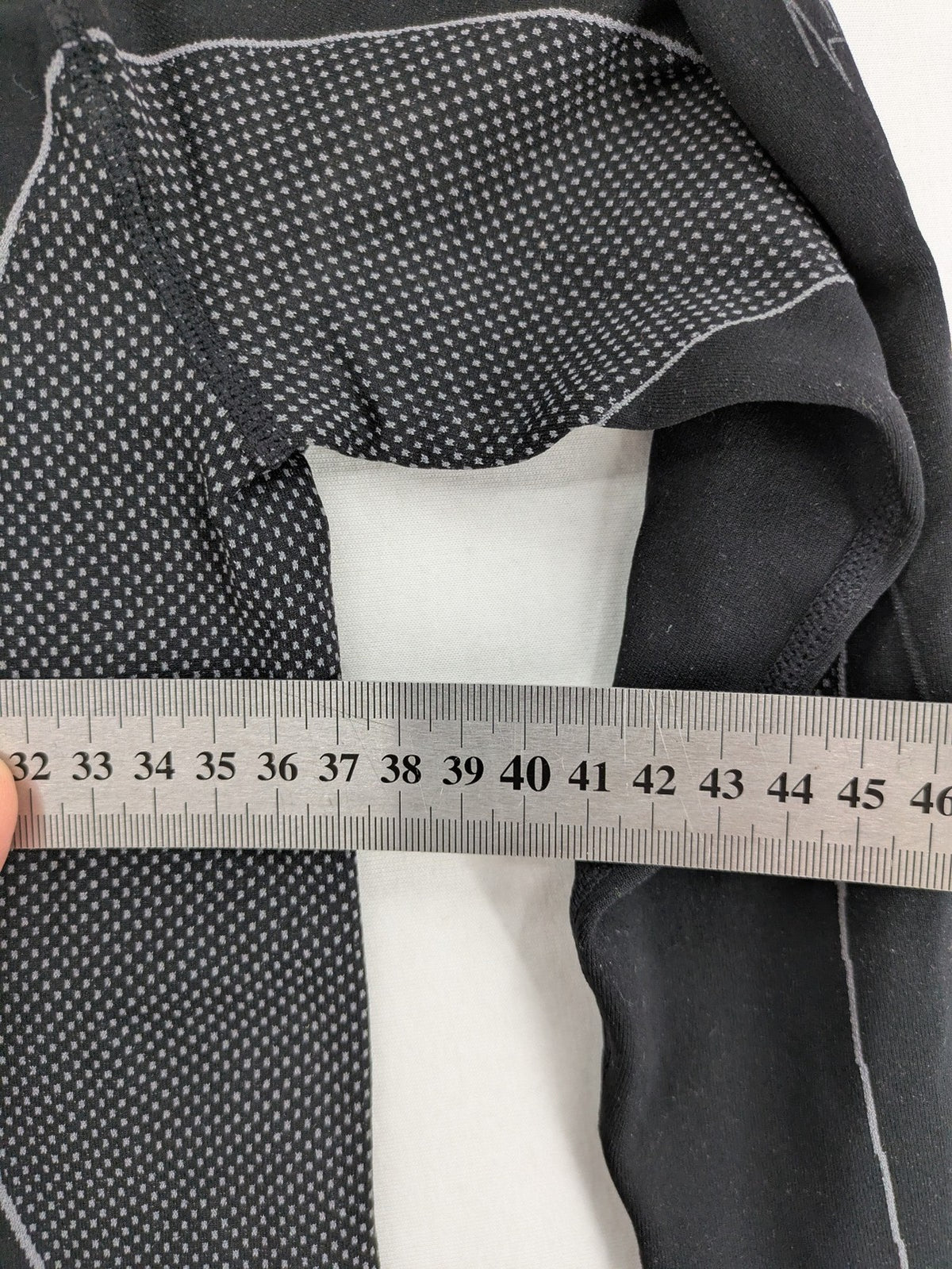 Iron-ic black long sleeve baselayer top with standing collar and thumbholes.