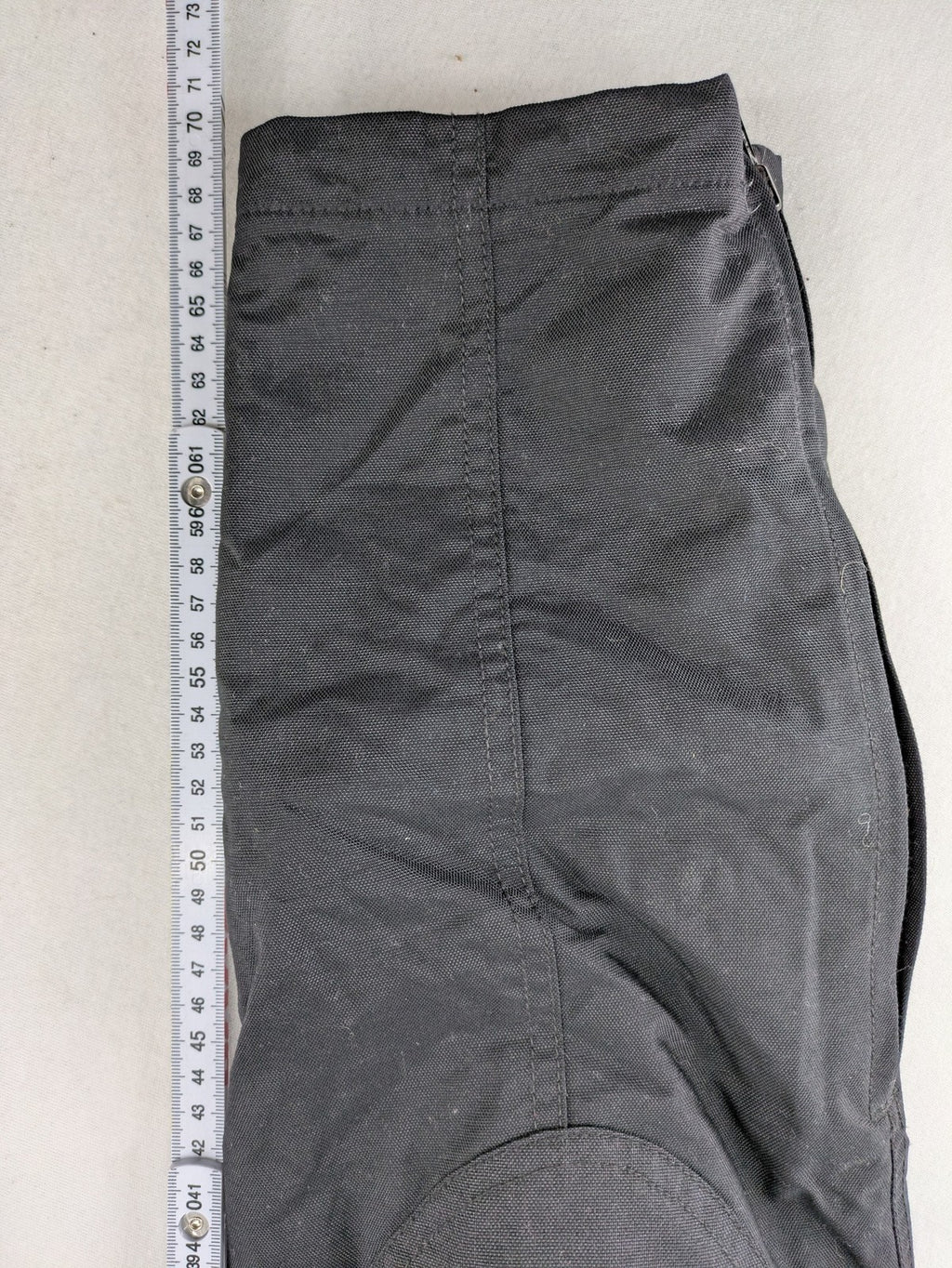 iXS black chaps with grey accents, waterproof textile, adjustable belt, reinforced knees.
