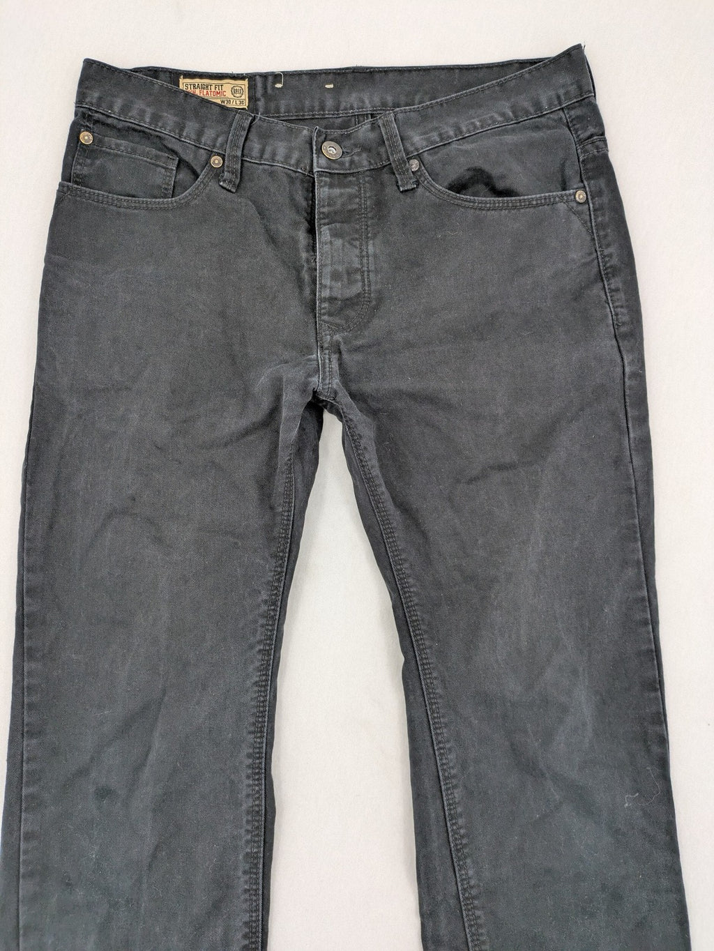 Ckh grey straight fit jeans with button fly and faded wash details.