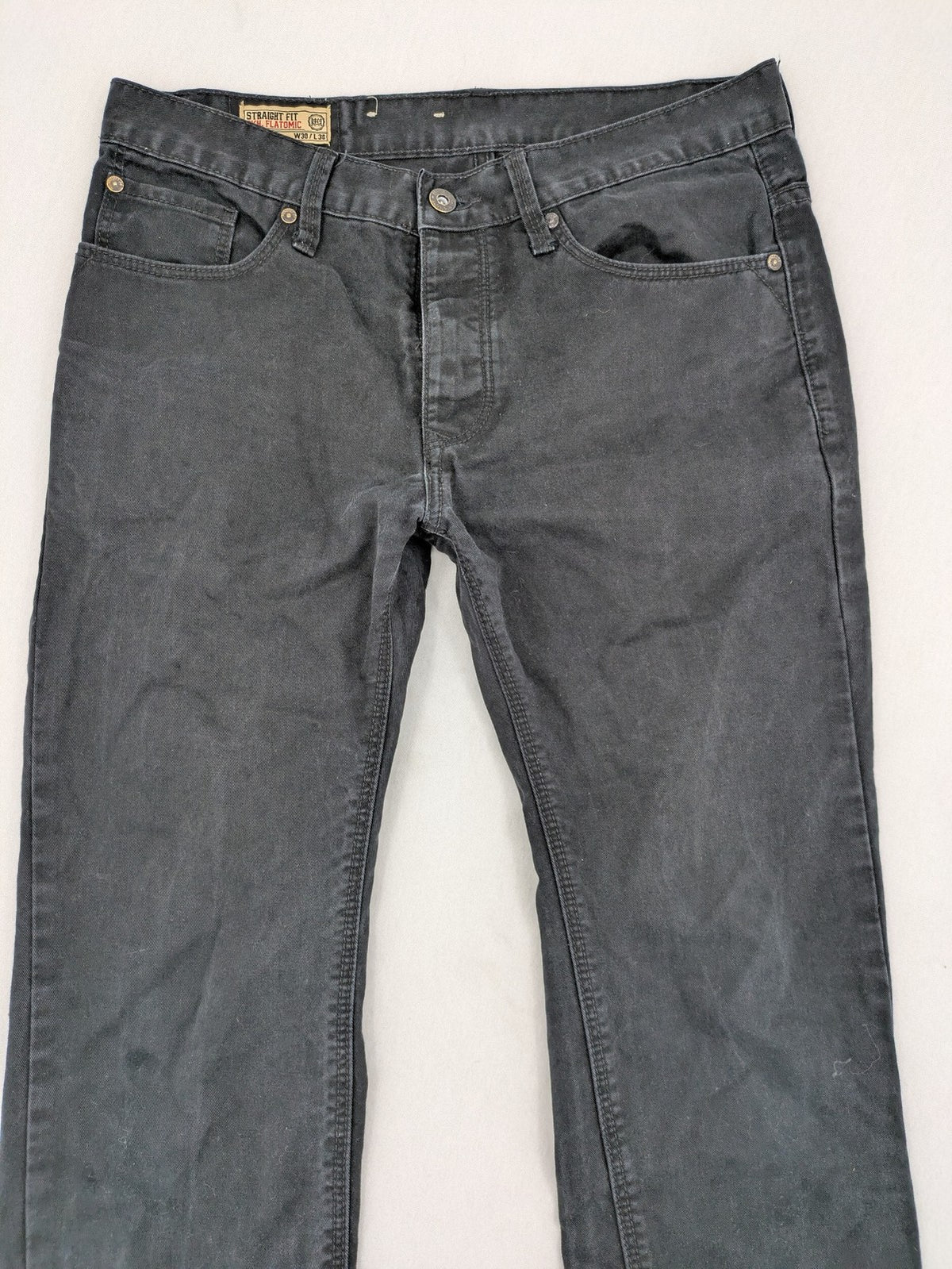 Ckh grey straight fit jeans with button fly and faded wash details.