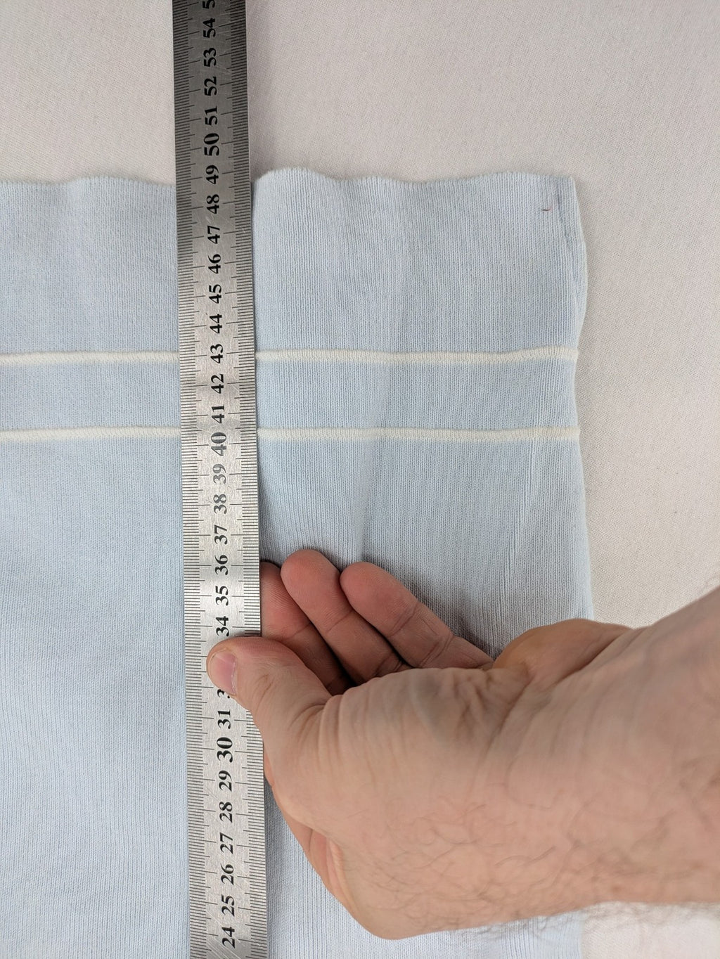 Donaldson multi turtle neck jumper light blue with embroidered Minnie Mouse graphic and ribbed texture.