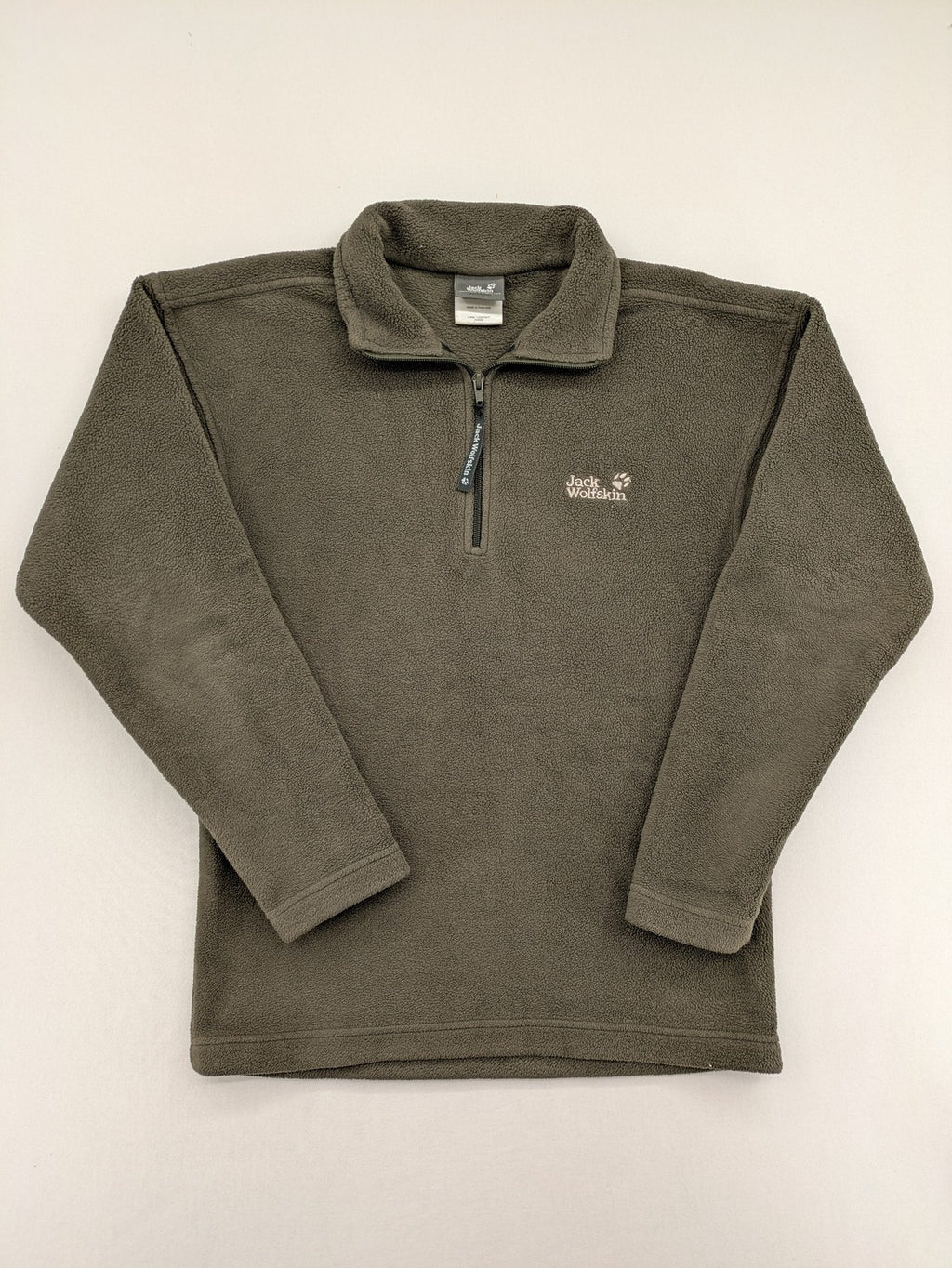 Jack Wolfskin khaki turtle neck jumper with quarter zip and embroidered paw logo.