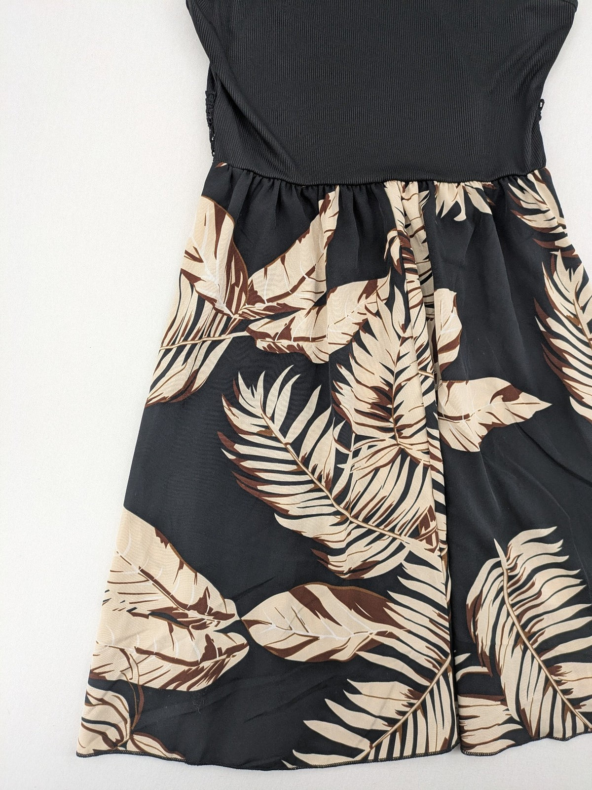 Kontrast summer dress beige tropical leaf print with black ribbed tank top and lace trim.