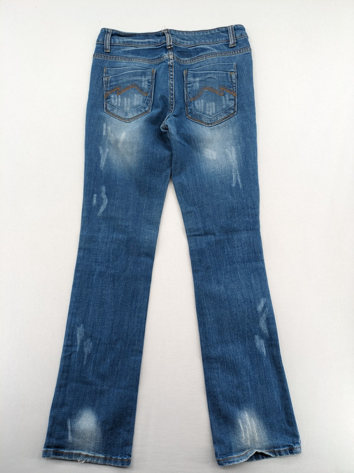 Denim blue straight jeans low rise bootcut with classic 5-pocket design and subtle rivets.