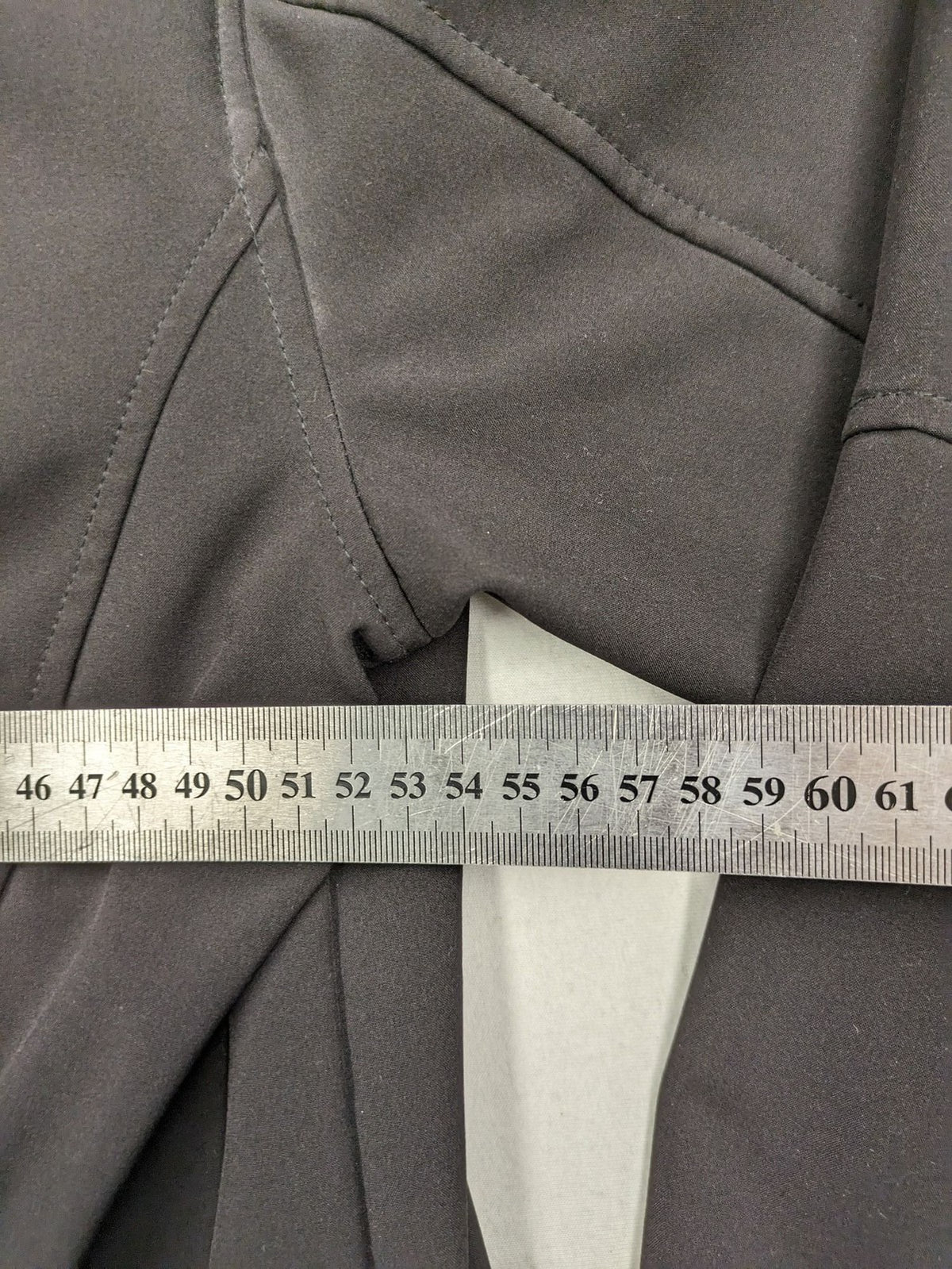 Maui Sports grey softshell jacket XL with contrasting yellow zipper and multiple pockets.
