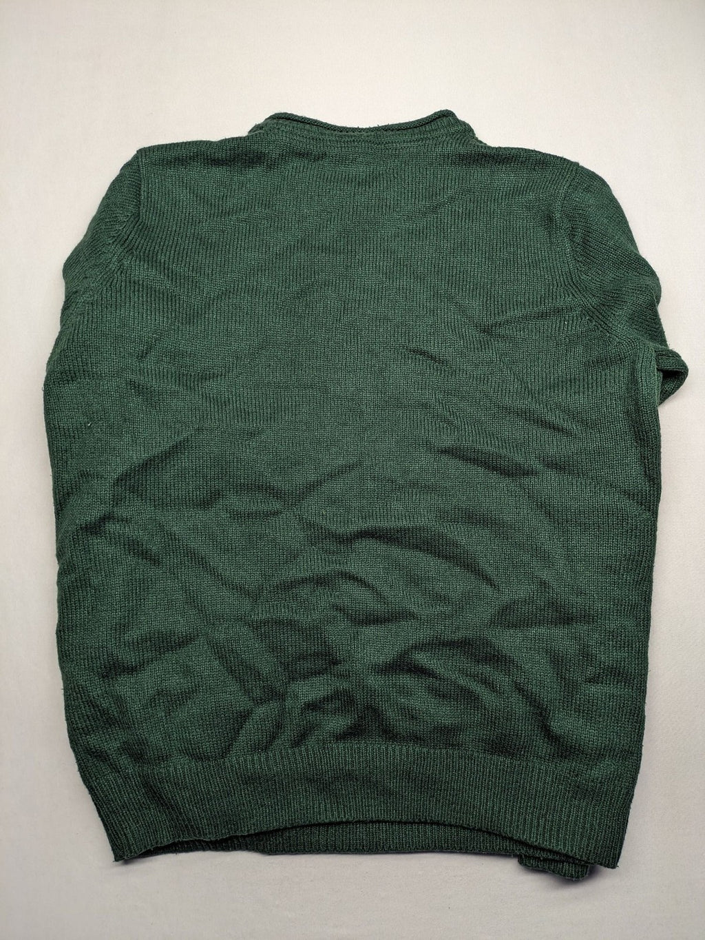 Broken Standard turtle neck jumper green waffle knit texture with classic round neckline.