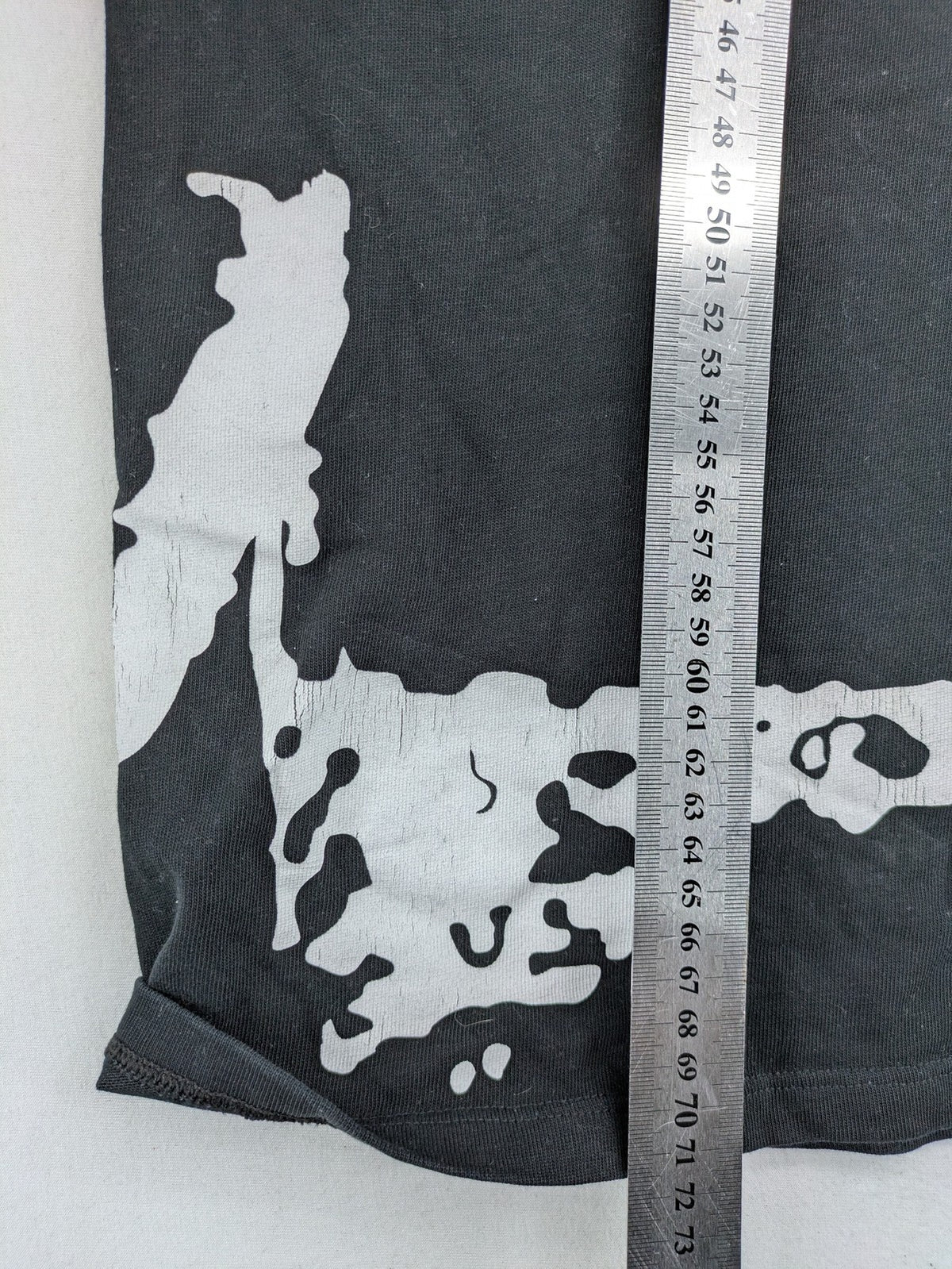 Barrow grey t-shirt with large black and white smiley graphic print and logo patch.