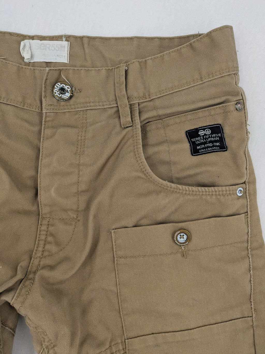 Crosshatch grey cargo pants with multiple pockets and durable cotton-polyester blend.