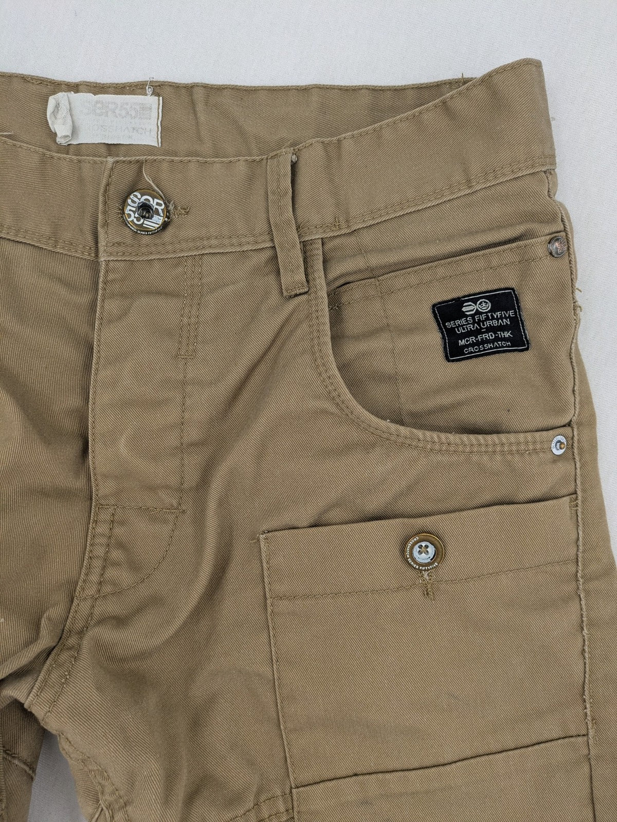Crosshatch grey cargo pants with multiple pockets and durable cotton-polyester blend.