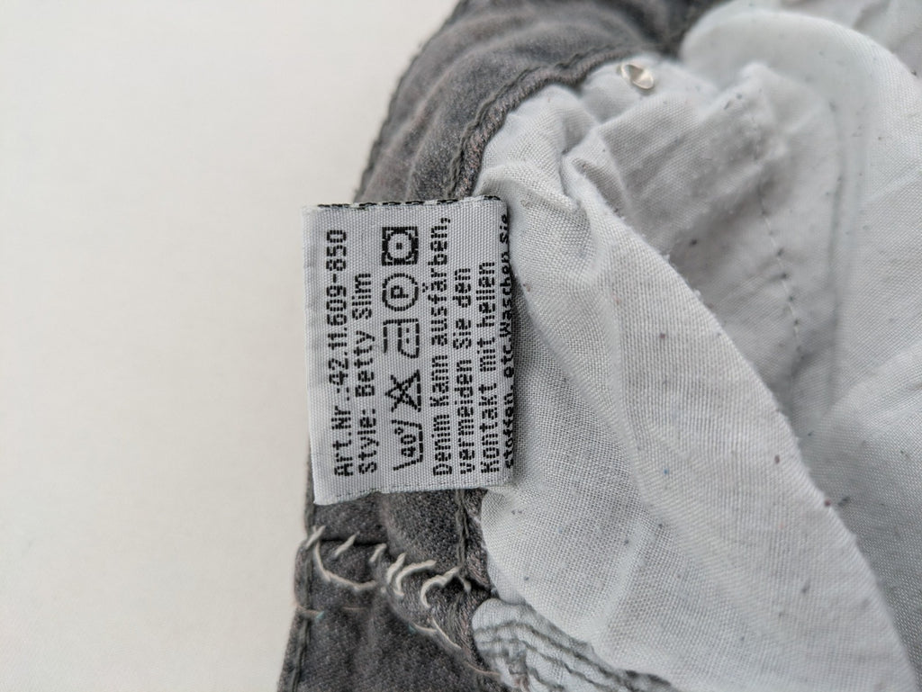 Jet Line grey straight jeans with embellished back pockets and frayed hem details.