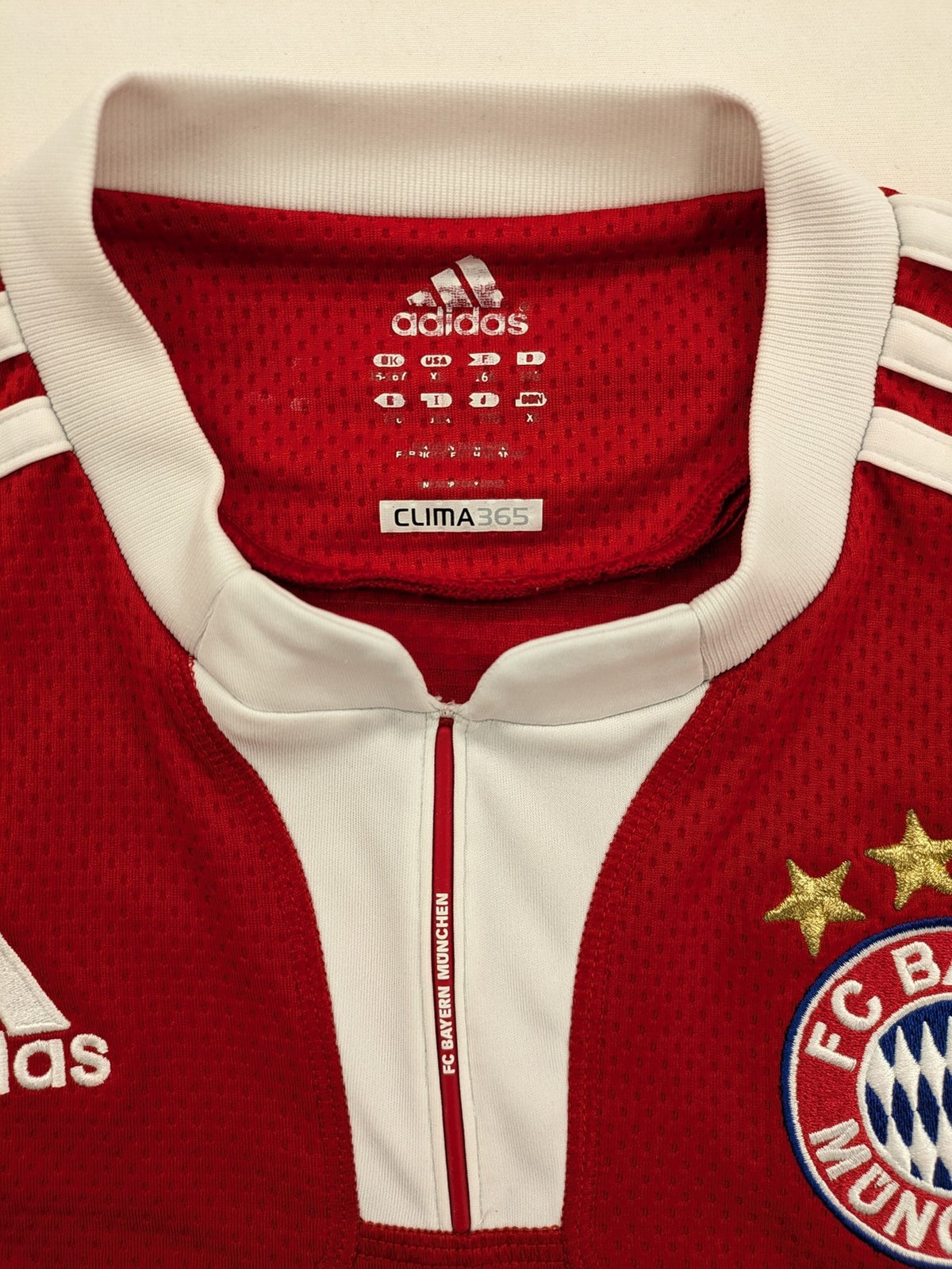 Adidas red soccer uniform with T-Home logo and embroidered FC Bayern München crest.