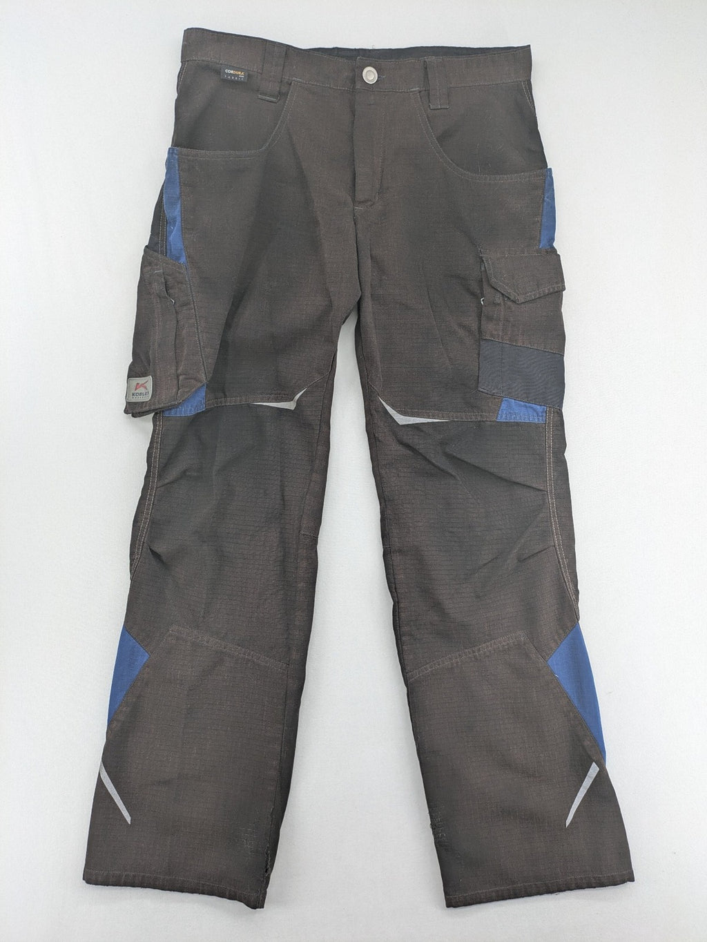 Kübler work pants blue grey Cordura fabric with multiple cargo pockets and reflective details.
