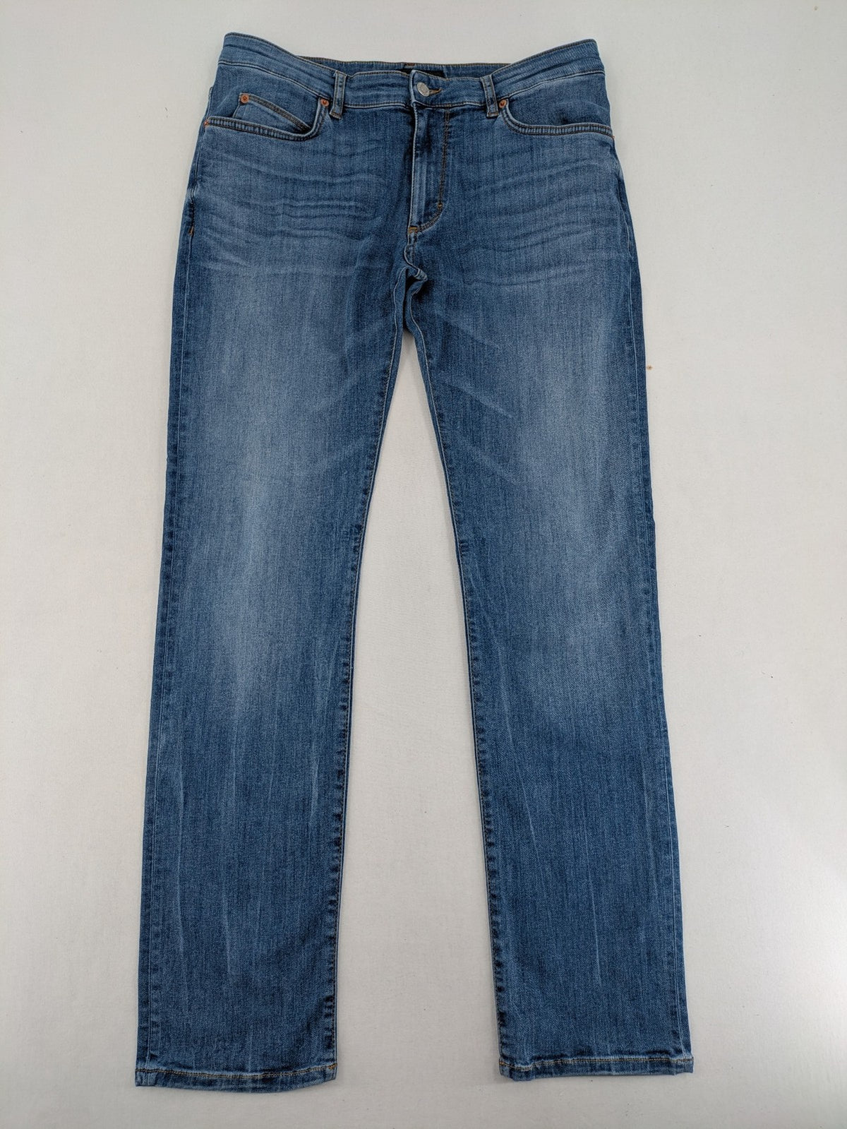 Drykorn blue straight jeans with stretch denim, classic fit, and logo patch on waistband.