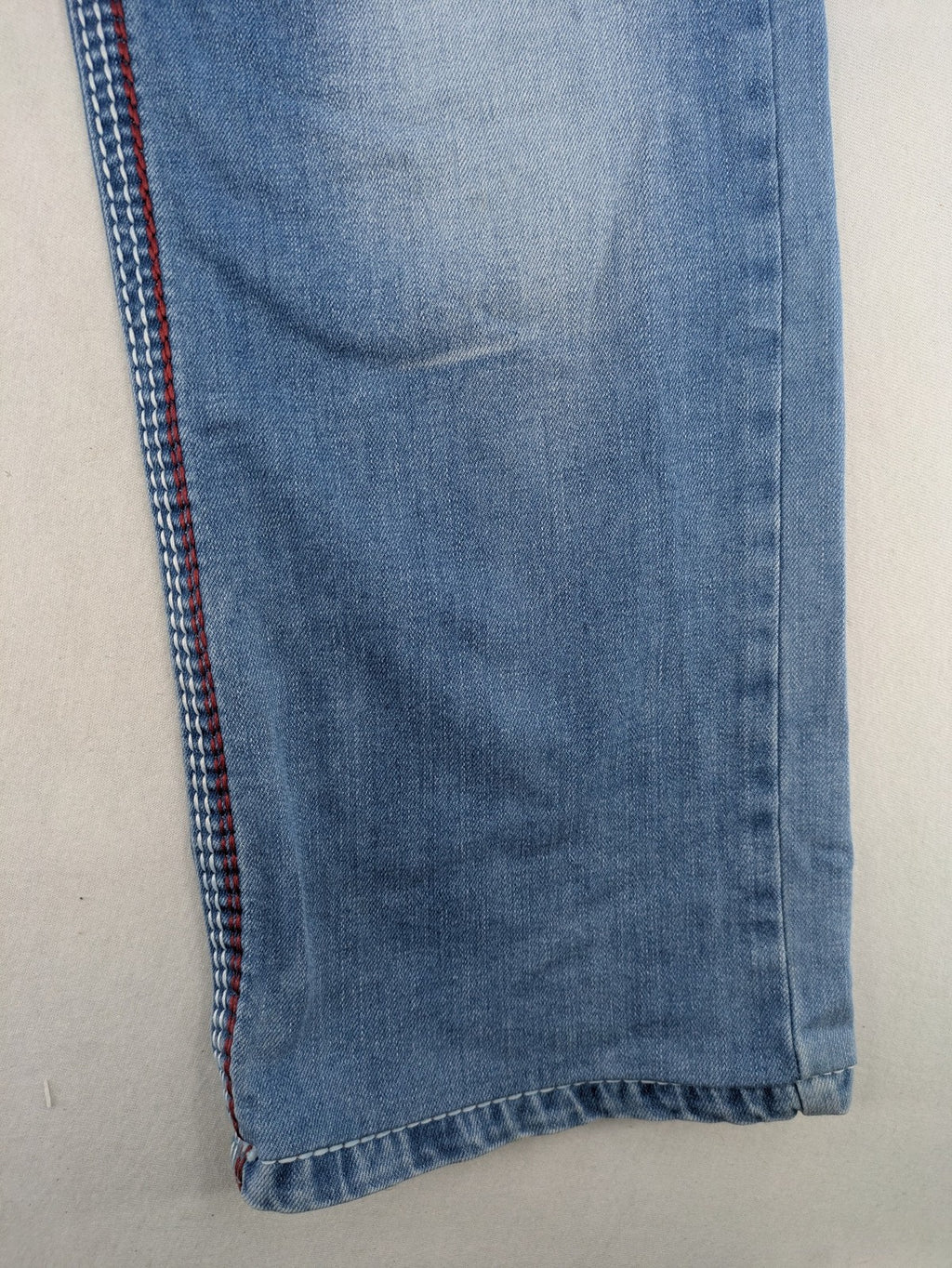 R-Neal blue straight jeans with red-white contrast stitching and classic 5-pocket design.