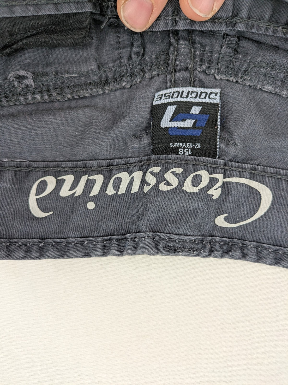 Crosswind grey cargo shorts with multiple pockets and durable cotton material.