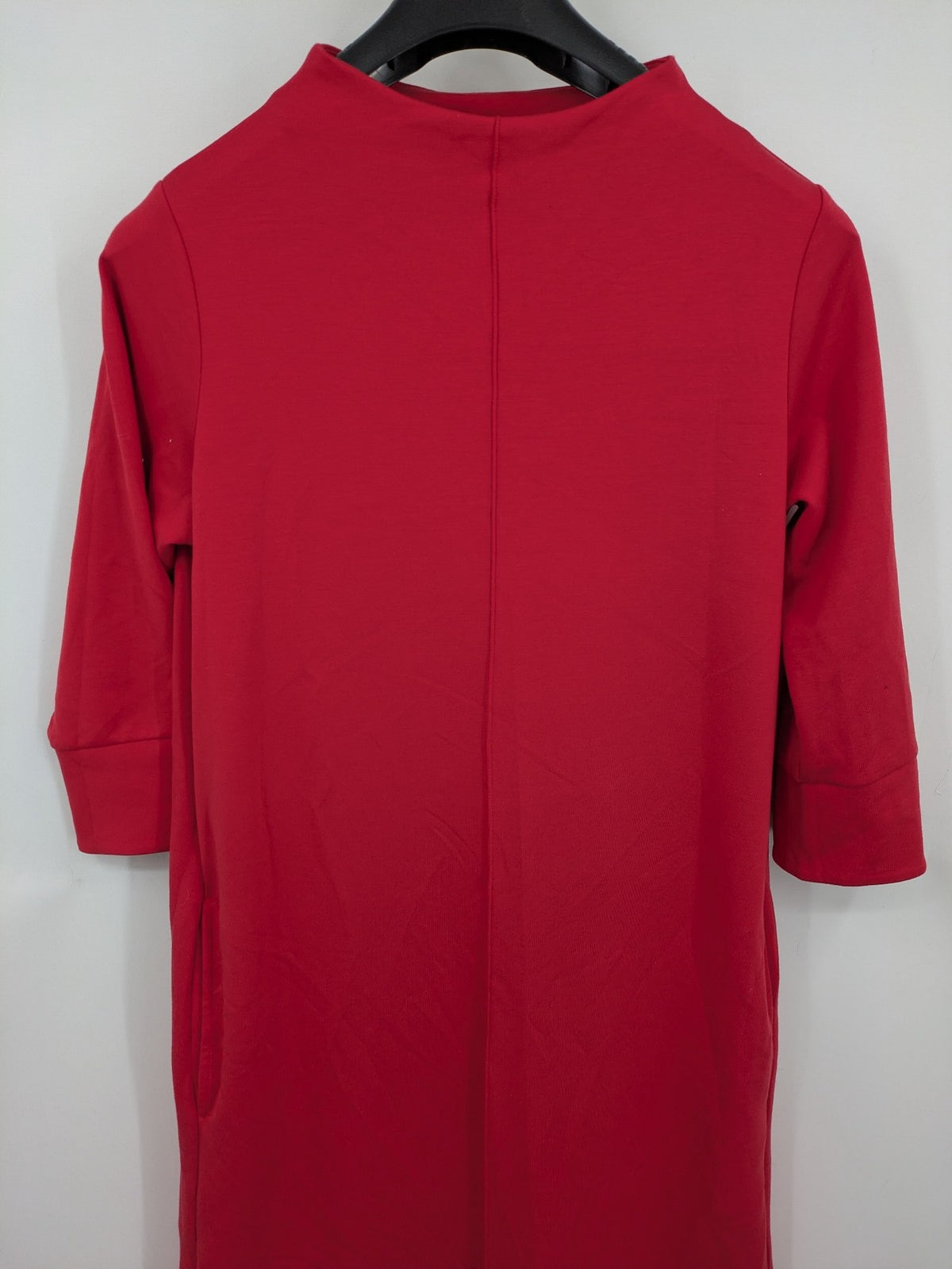 H&M red A-line dress with stand collar, 3/4 sleeves, and side pockets in stretchy jersey.