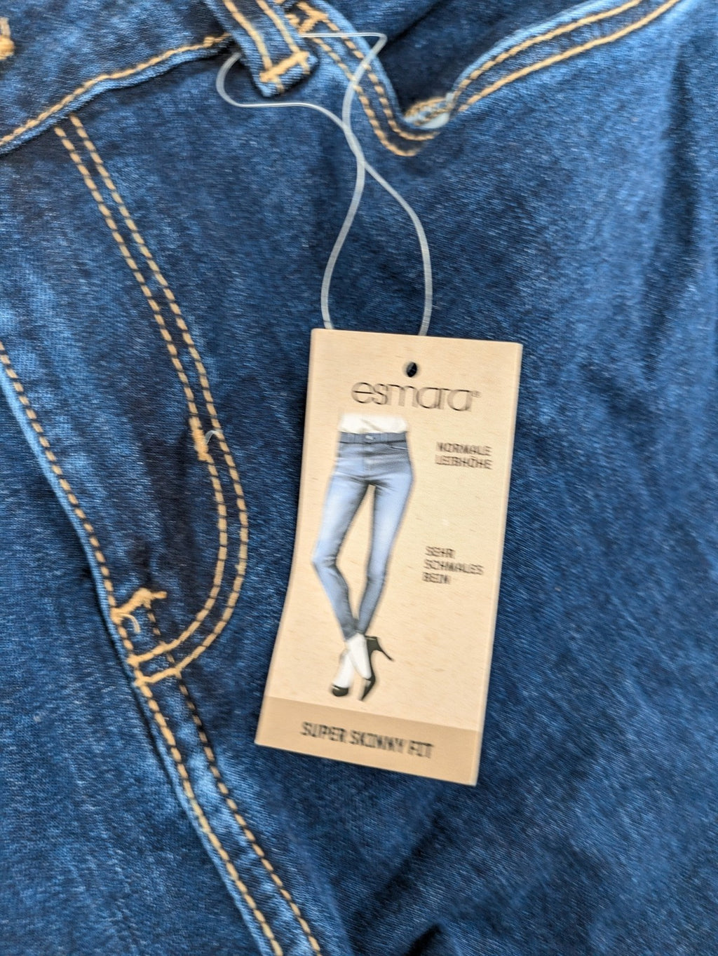 ESMARA blue super skinny jeans with dark wash and stretch denim material.