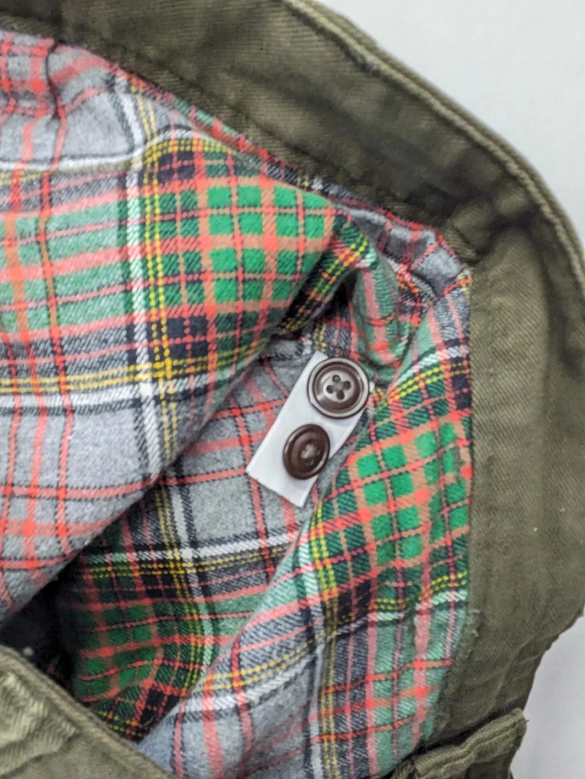 Lands' End green cargo pants with plaid flannel lining and traditional fit design.