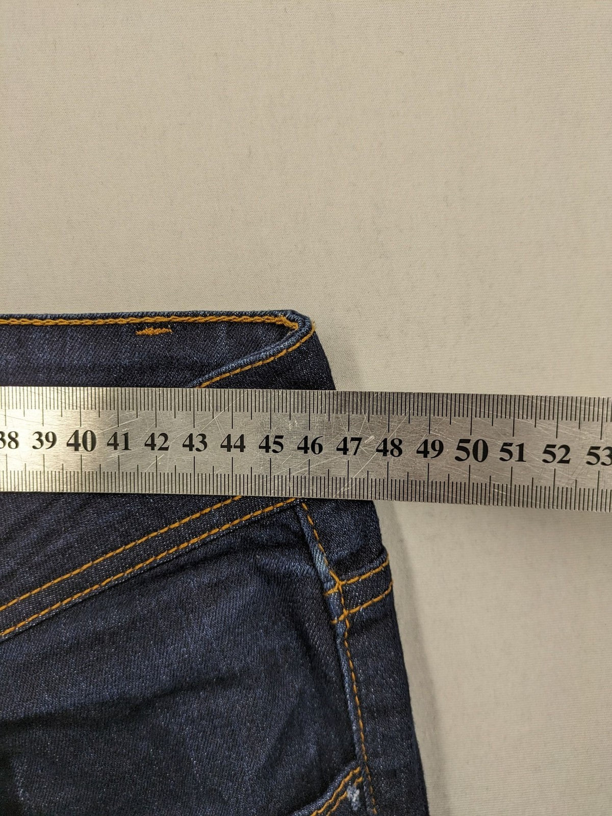 Okay blue straight jeans dark wash 5-pocket style with stretch material for comfort.