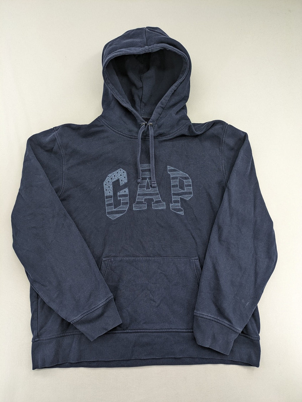 Gap zip-through hoodie navy blue with iconic logo and American flag graphic.