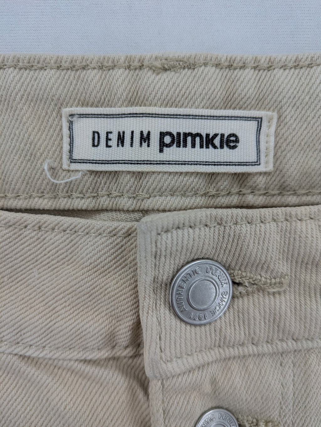Pimkie beige mom jeans high waist tapered fit with front button placket and cotton material.