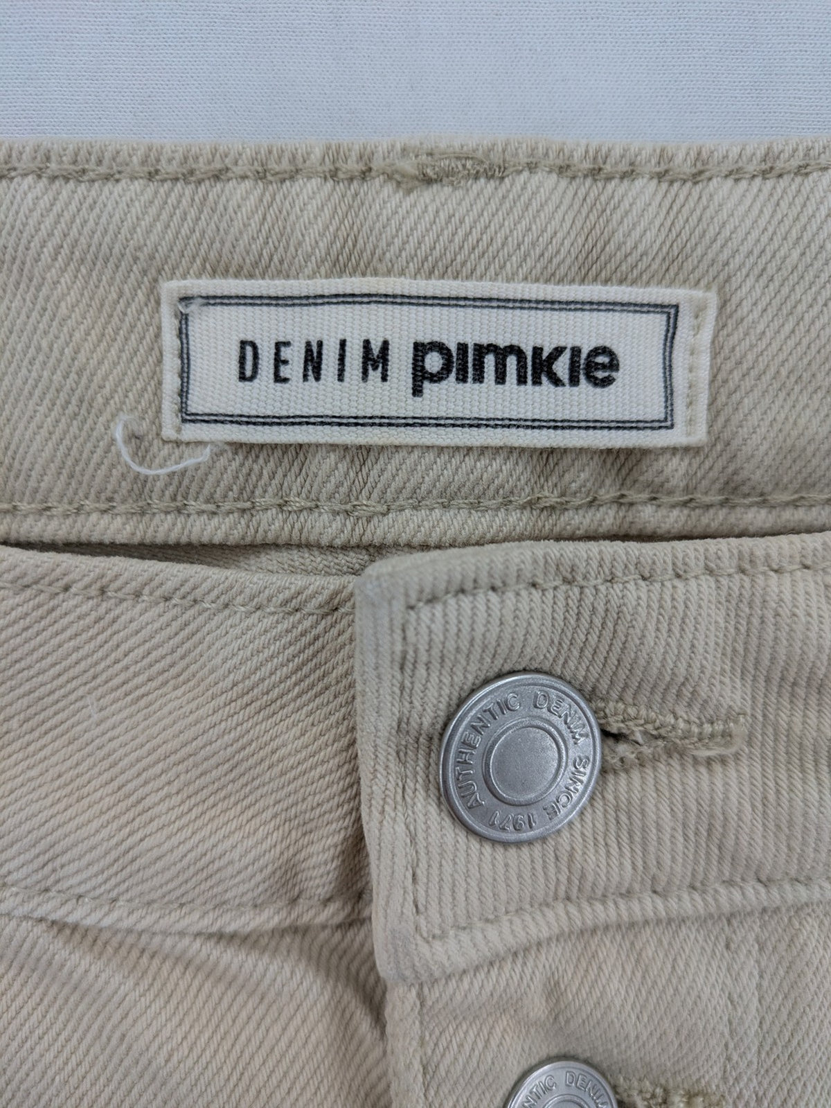 Pimkie beige mom jeans high waist tapered fit with front button placket and cotton material.