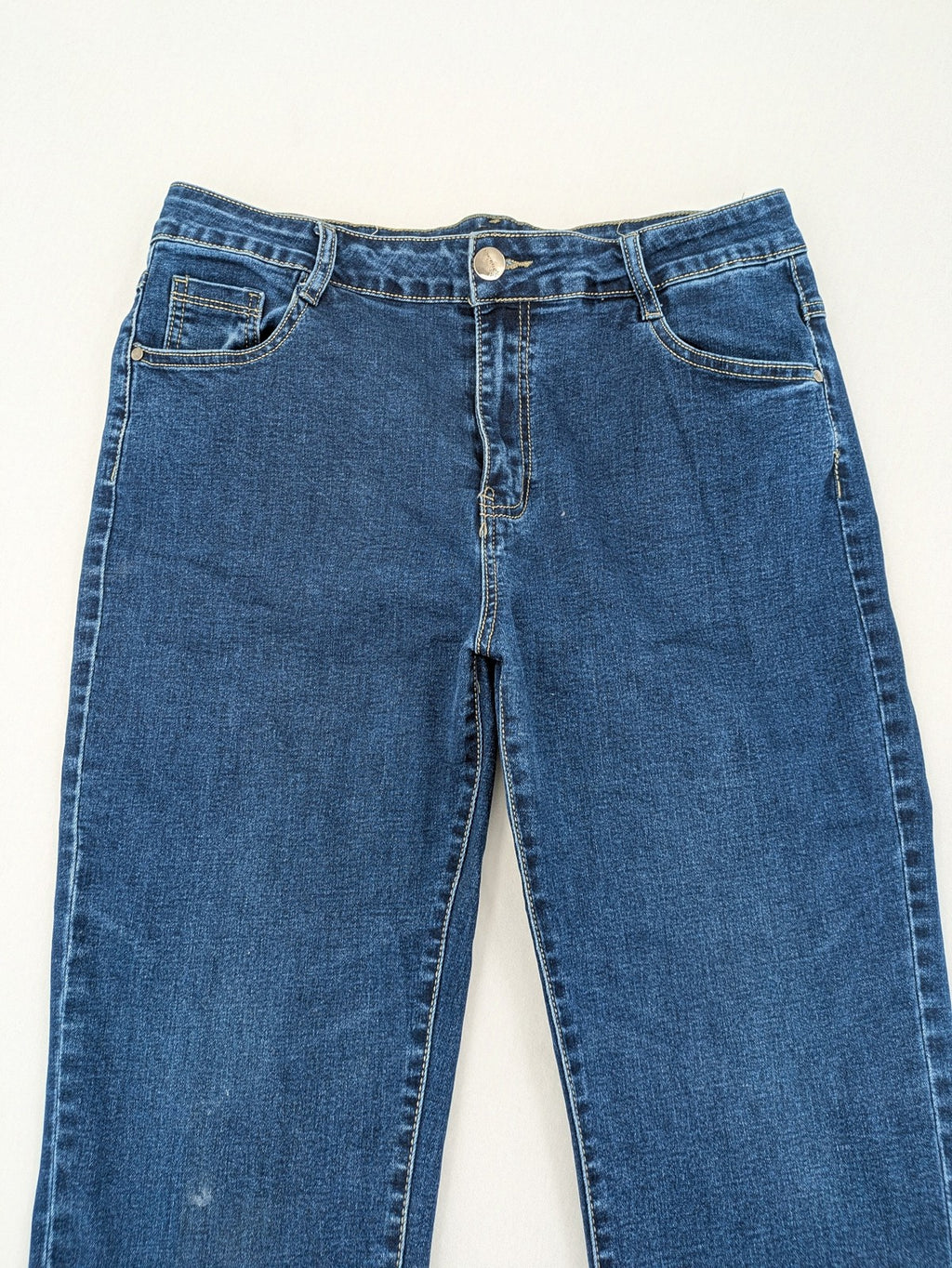 Miss Good blue straight jeans with 5-pocket design and decorative metal accent.