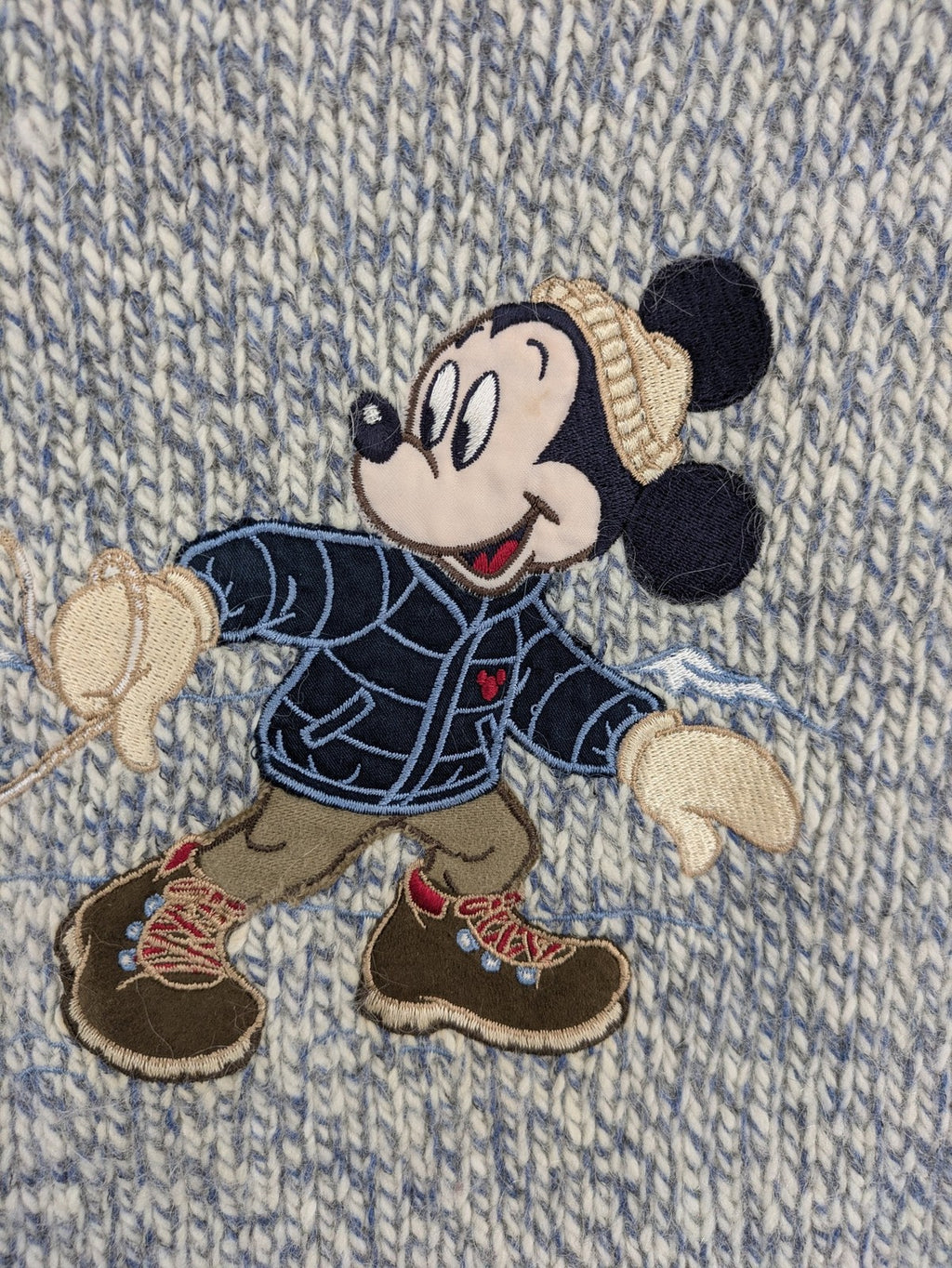 Disney blue turtle neck jumper with grey Mickey and Minnie Mouse embroidery, zip closure.