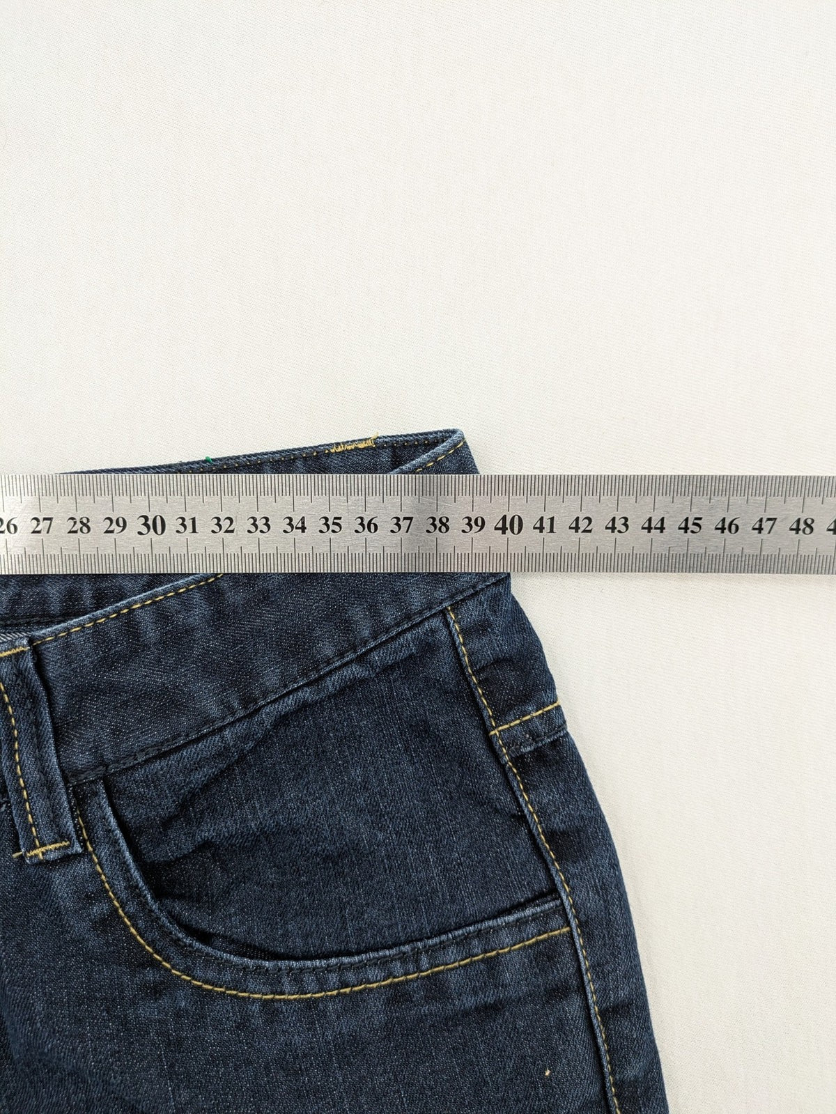 C&A blue straight leg jeans with classic 5-pocket design and faded wash details.