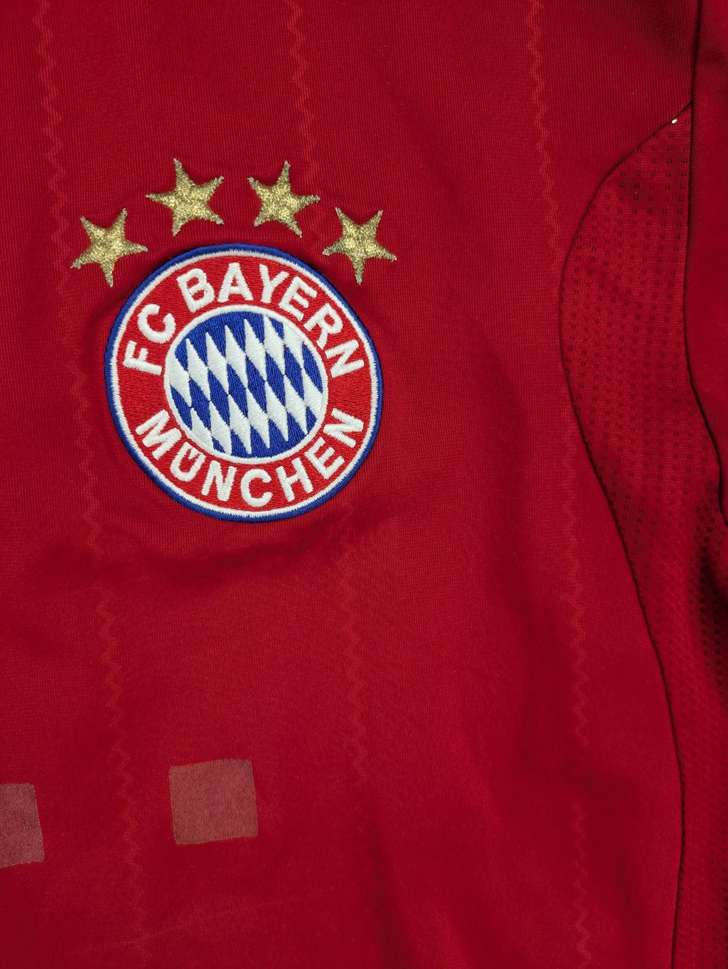 Adidas red soccer uniform with embroidered FC Bayern München crest and T-Mobile logo.