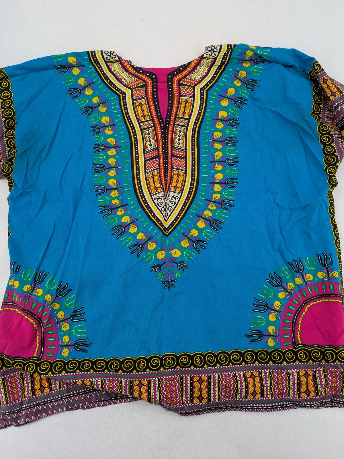 M/L multi Dashiki shirt with vibrant ethnic print on light blue cotton fabric.