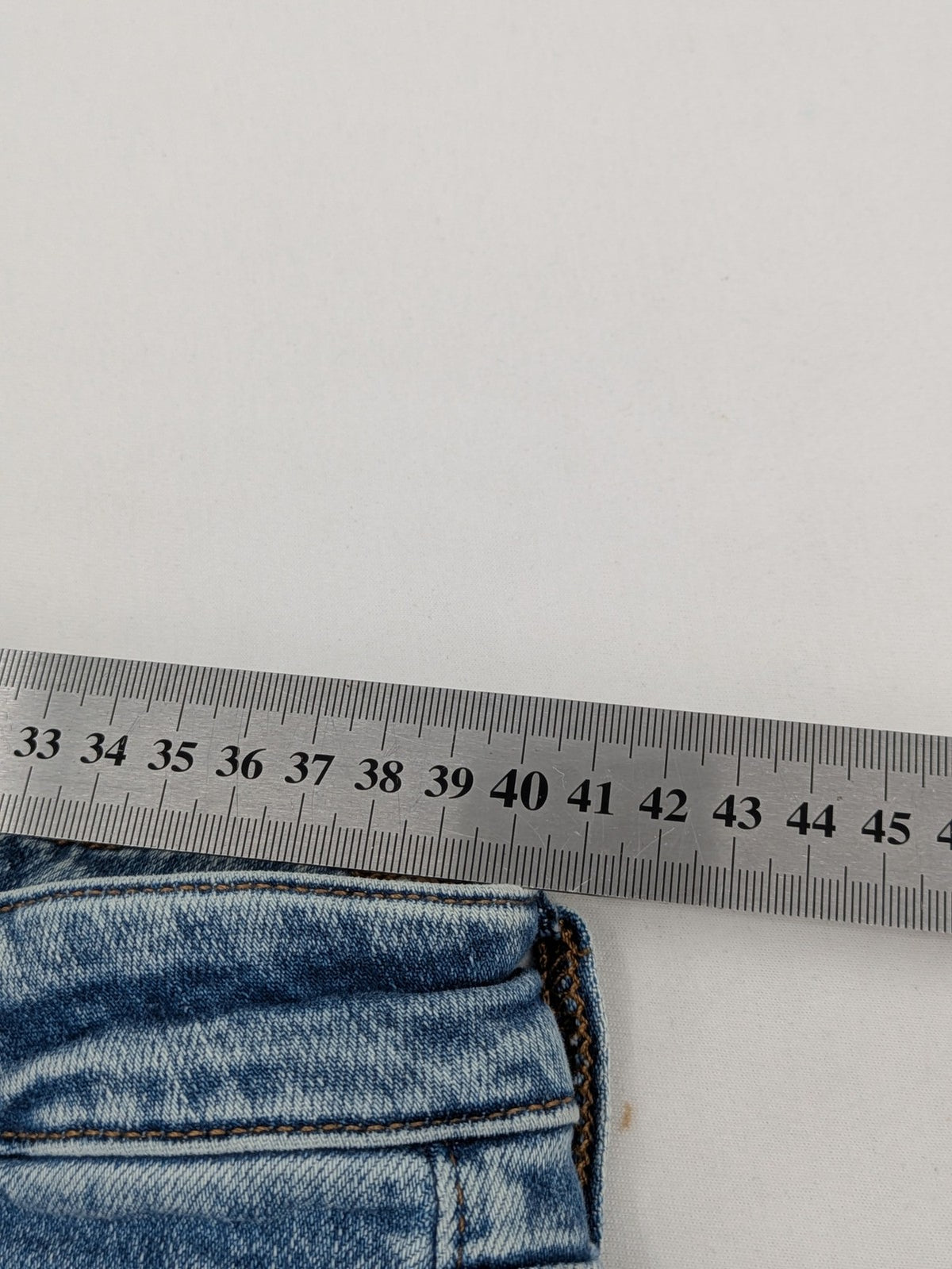 QS by s.Oliver green bootcut jeans with ankle zippers and classic denim wash.