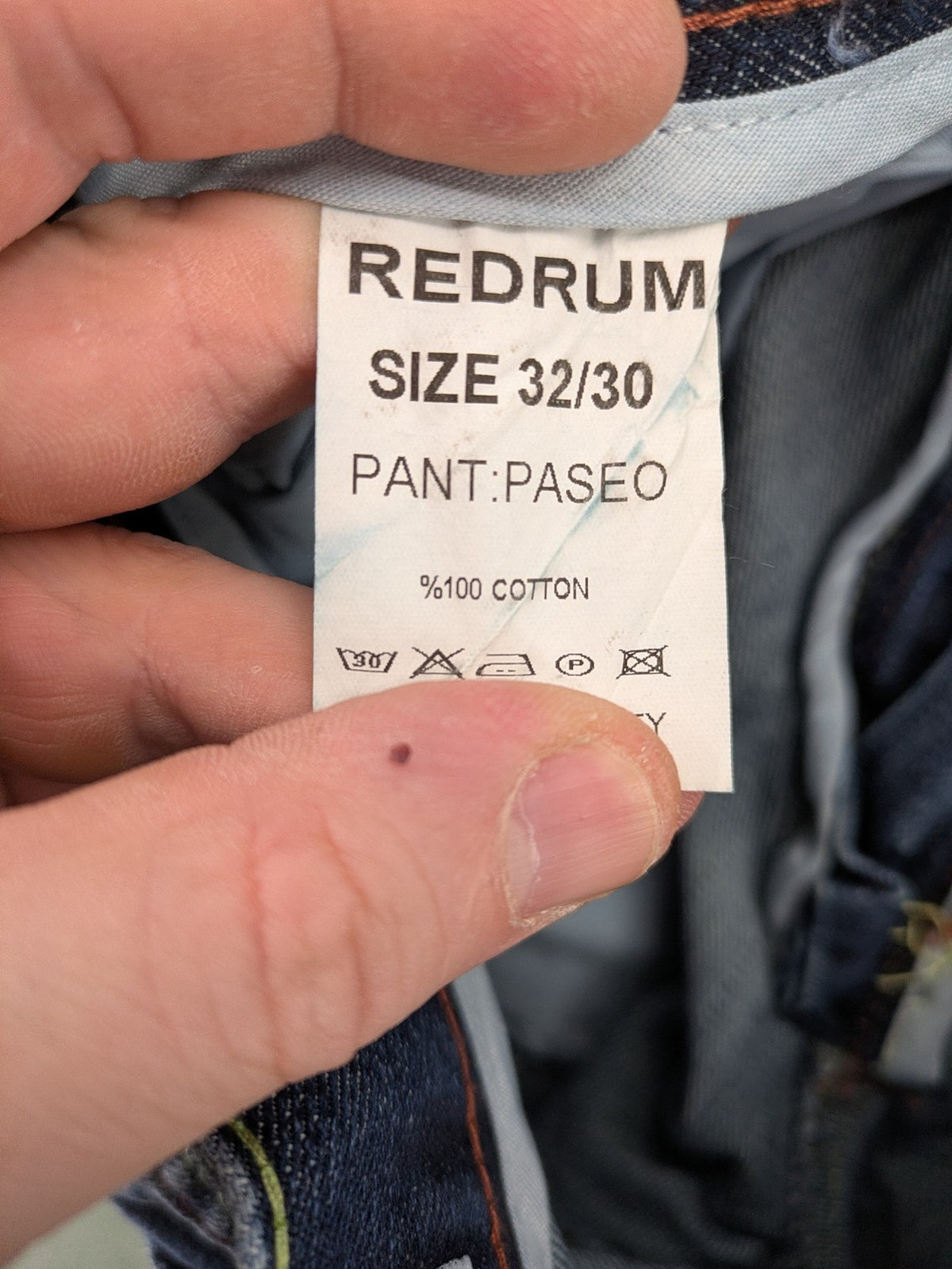 Y2K blue straight jeans with colorful logo embroidery and baggy fit.