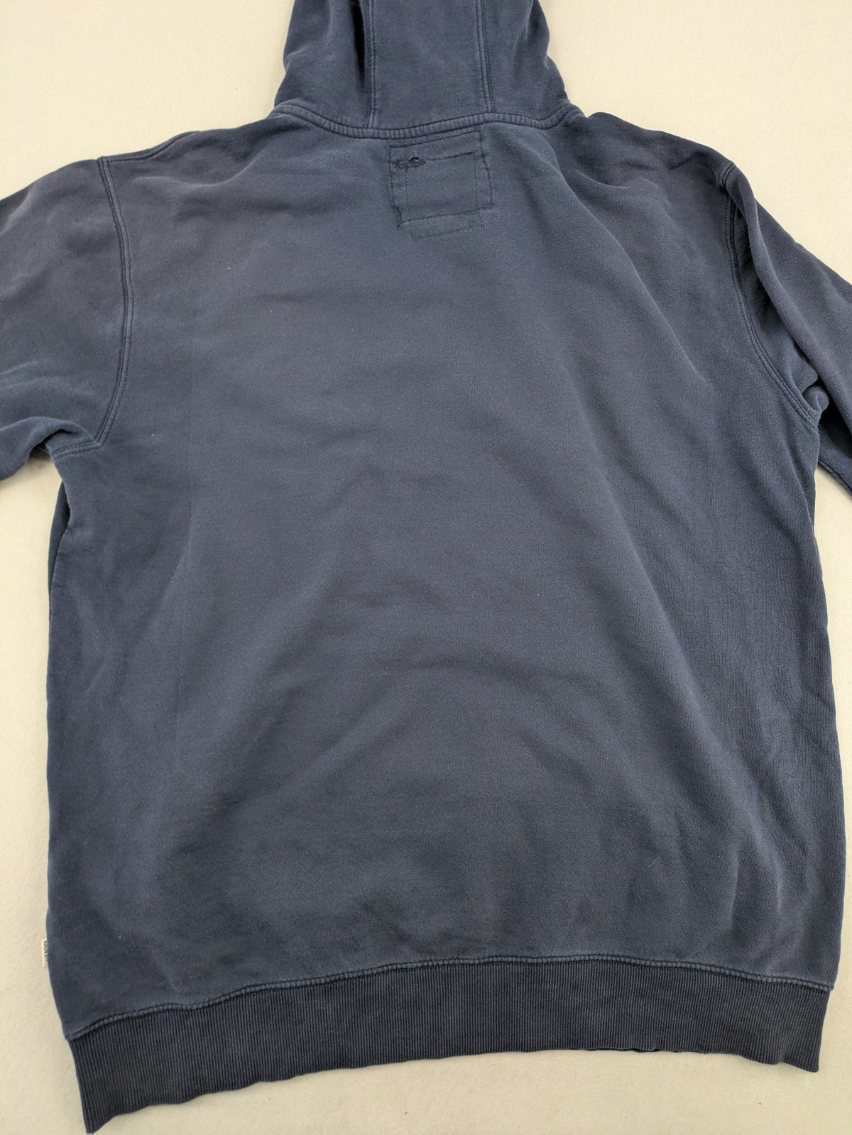 Vans zip-through hoodie navy blue with large yellow logo and kangaroo pocket.