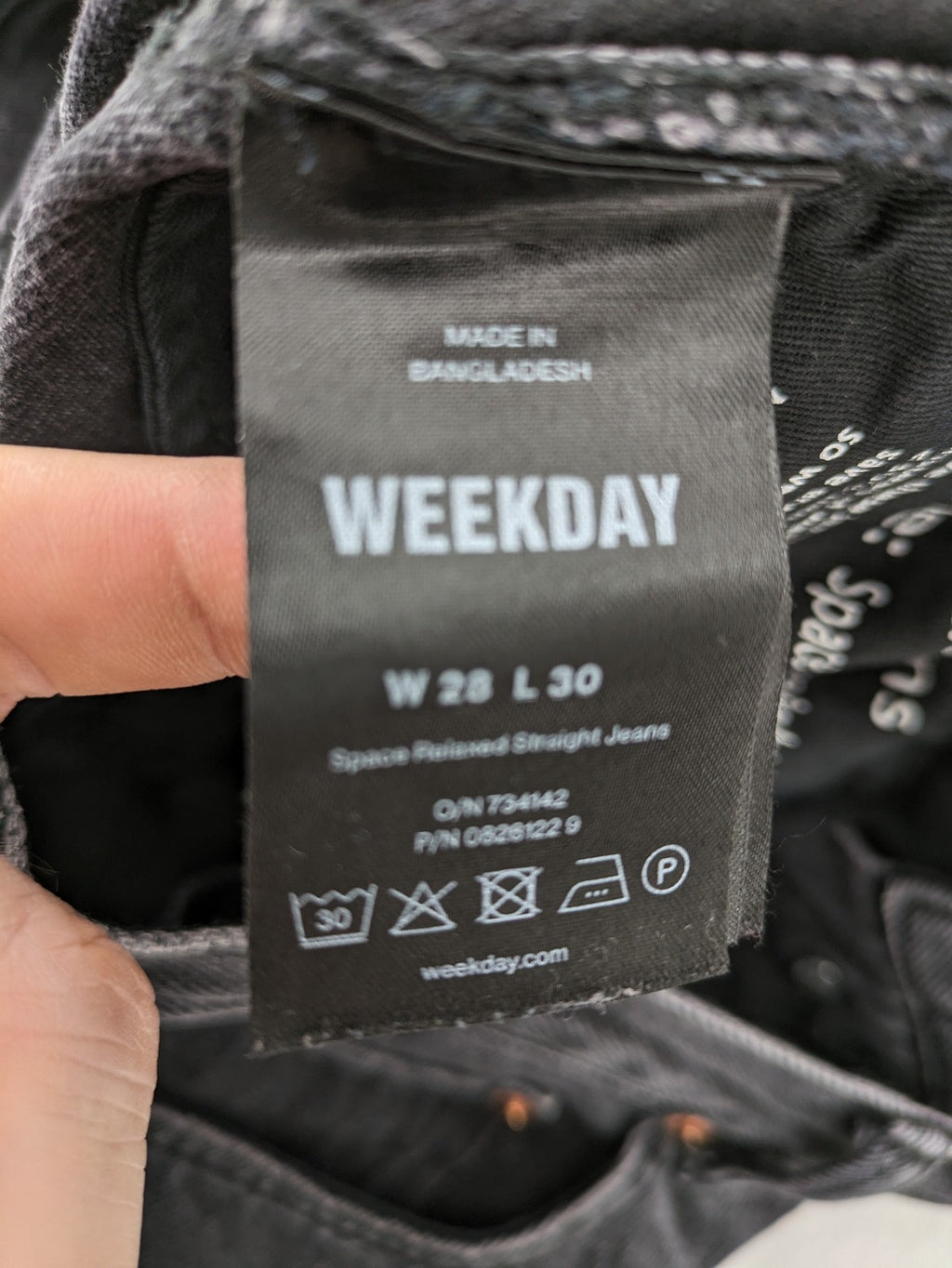Weekday grey straight jeans with button fly and classic denim design.