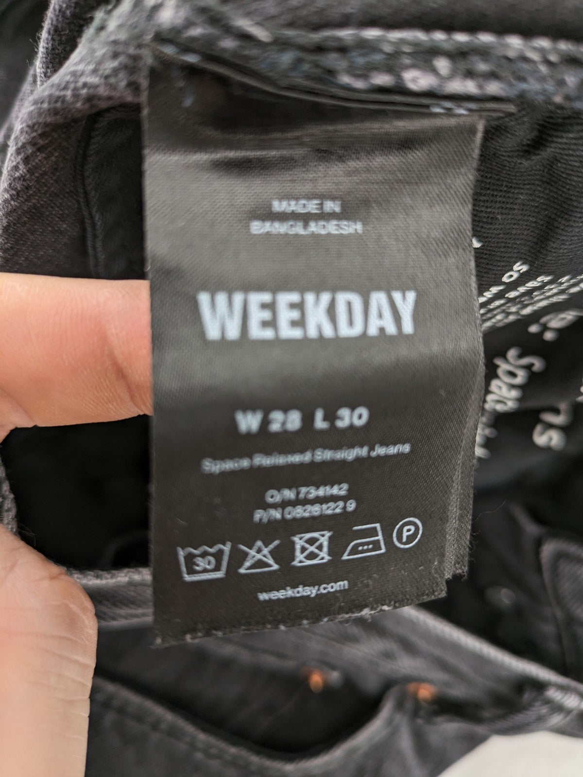 Weekday grey straight jeans with button fly and classic denim design.