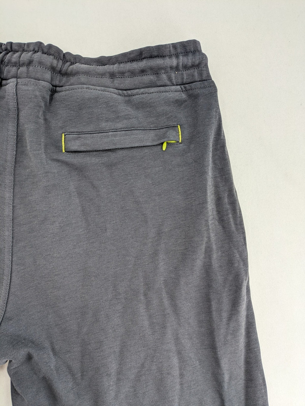 US Polo Assn grey sweatpants with light green drawstring and subtle logo detail.