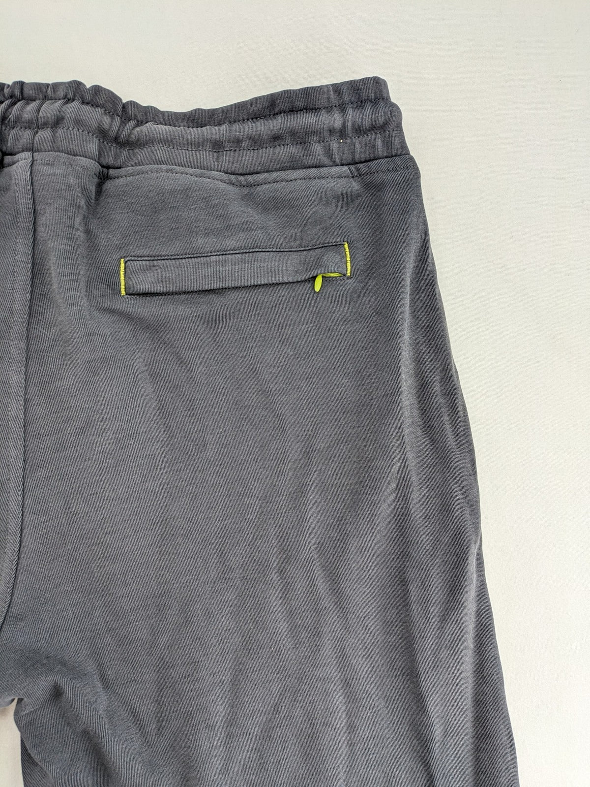 US Polo Assn grey sweatpants with light green drawstring and subtle logo detail.