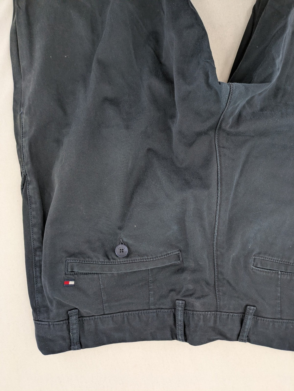 Tommy Hilfiger grey chino pants with TH-Flex stretch technology and classic straight fit design.