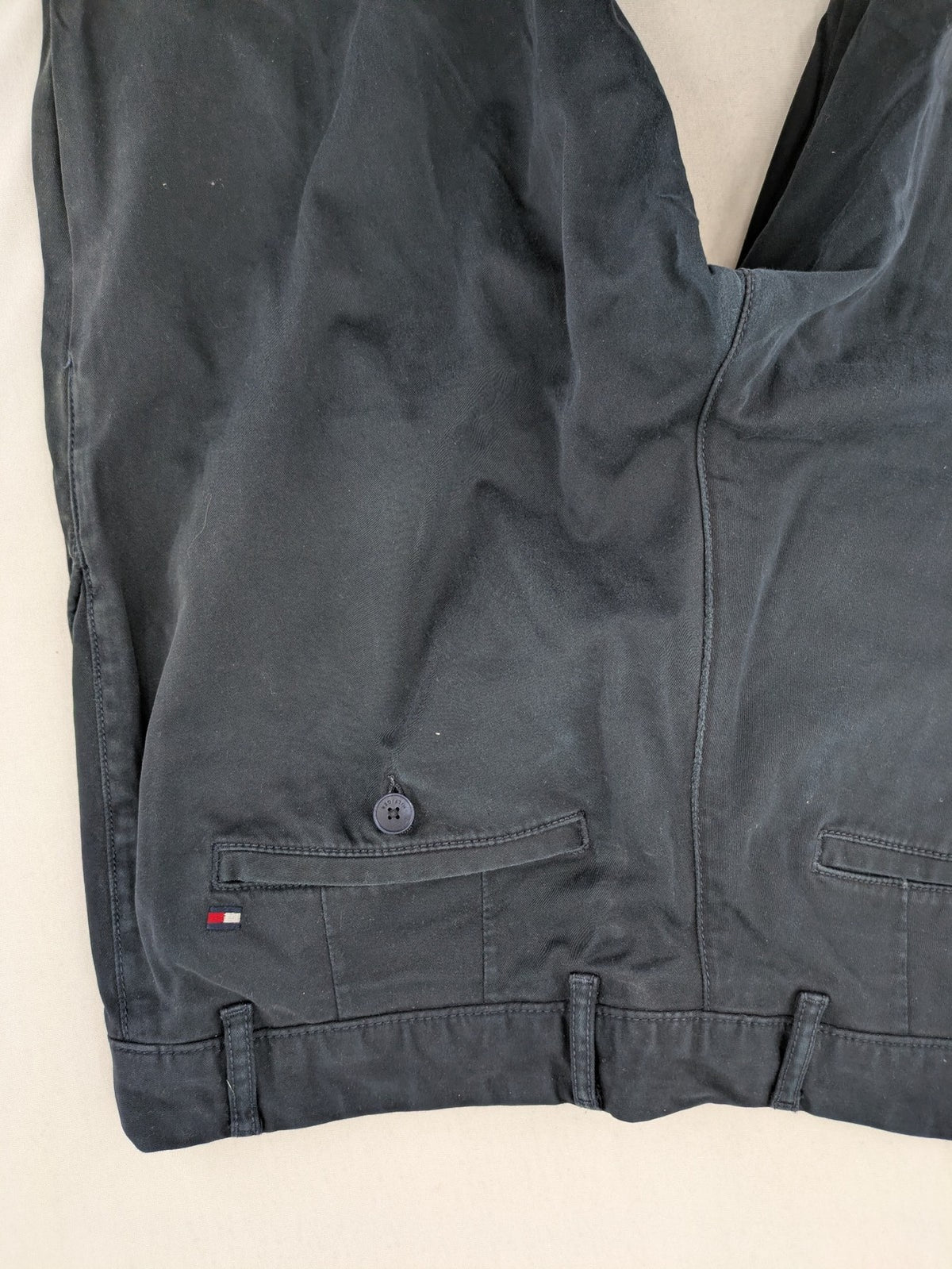 Tommy Hilfiger grey chino pants with TH-Flex stretch technology and classic straight fit design.