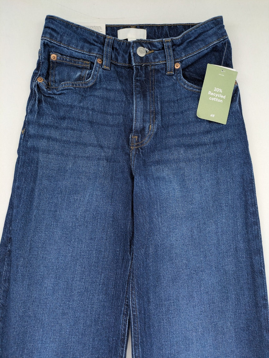 H&M blue wide leg high waist jeans with classic 5-pocket design and stretch denim.