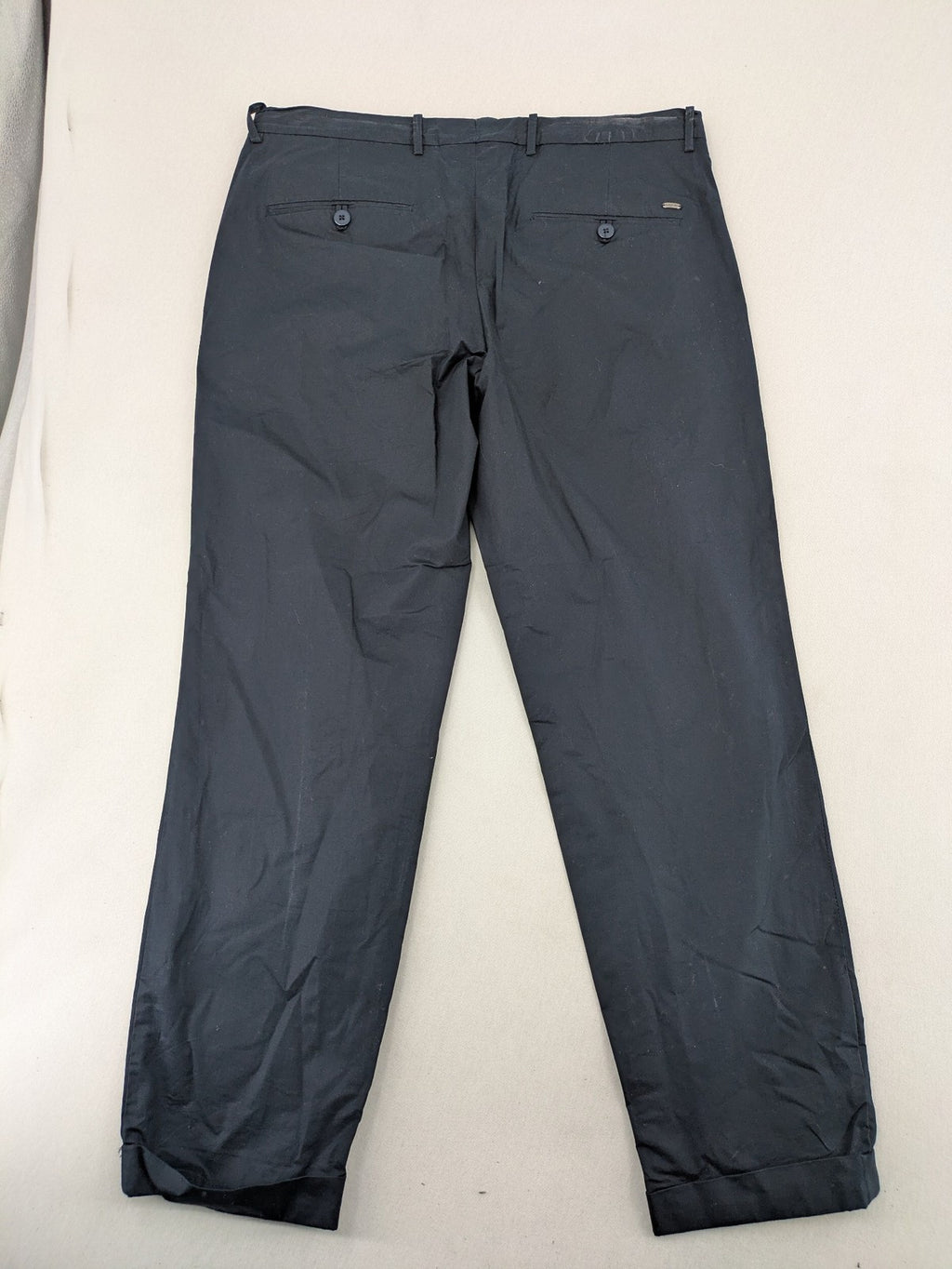 Mango Man black chinos flat front design with zipper and button closure.