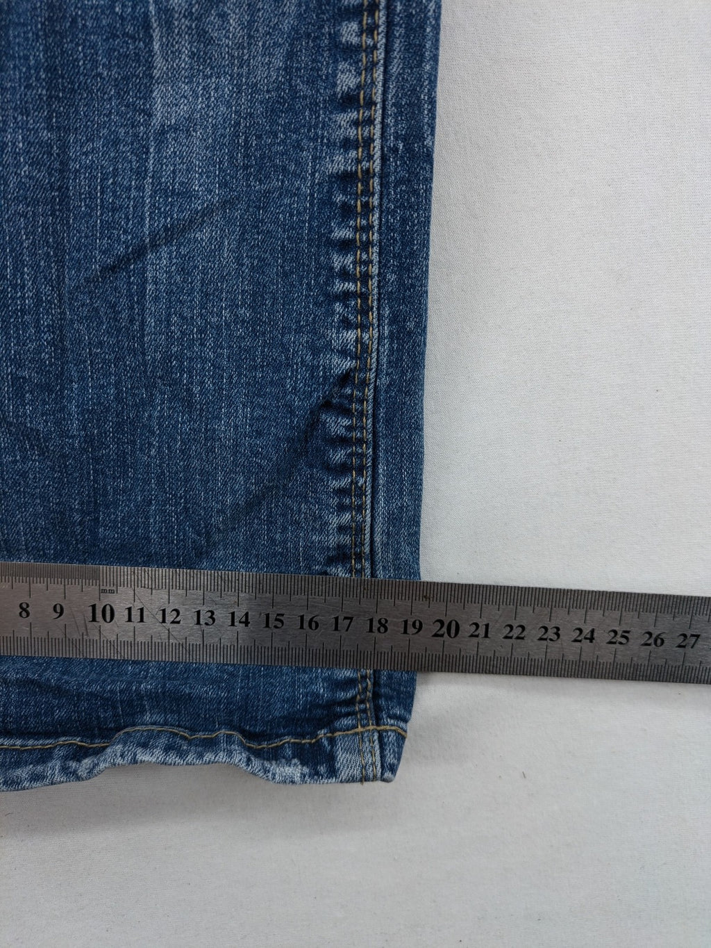 C&A blue bootcut jeans with faded denim and low rise fit, made from cotton blend.