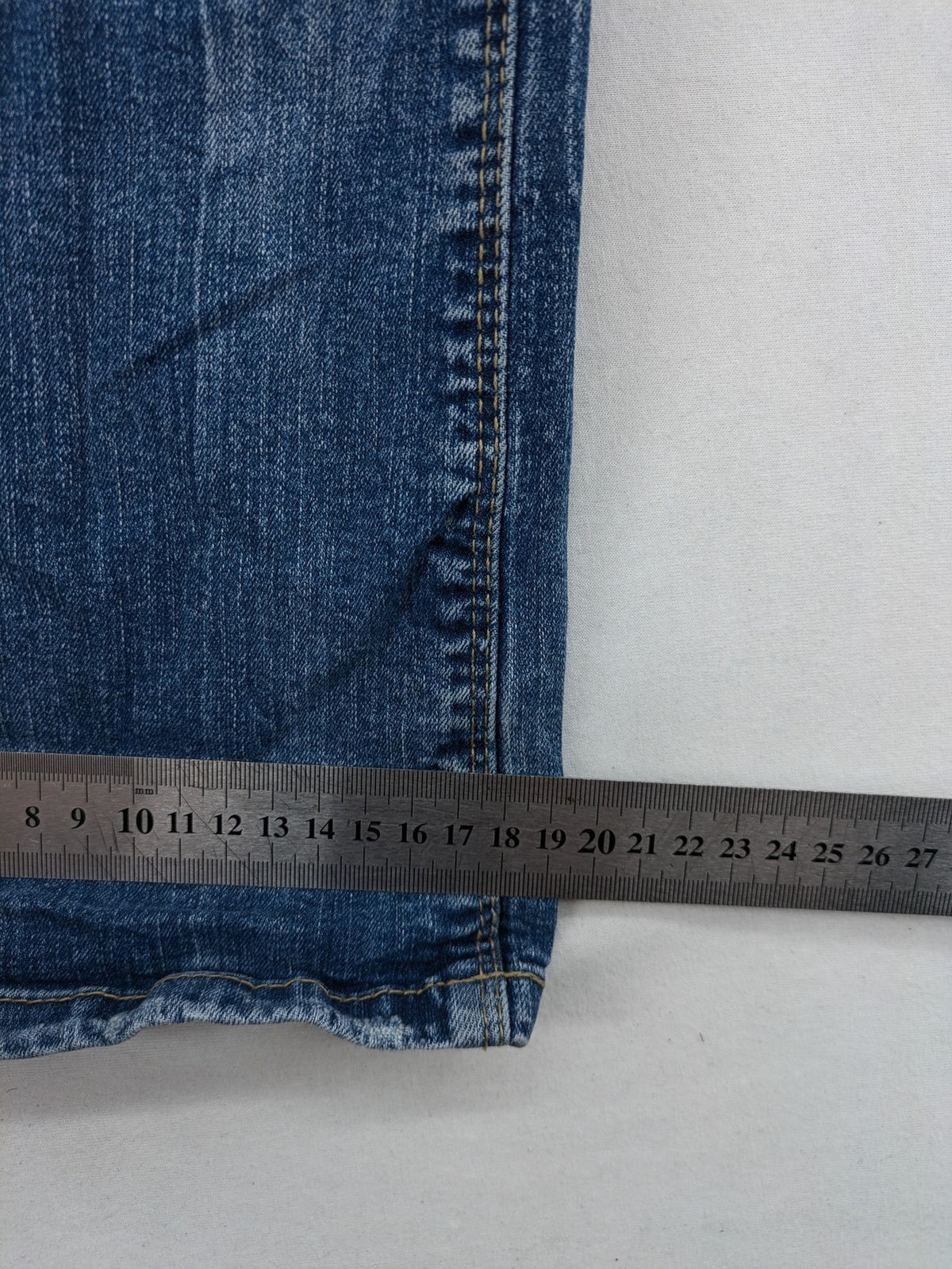 C&A blue bootcut jeans with faded denim and low rise fit, made from cotton blend.