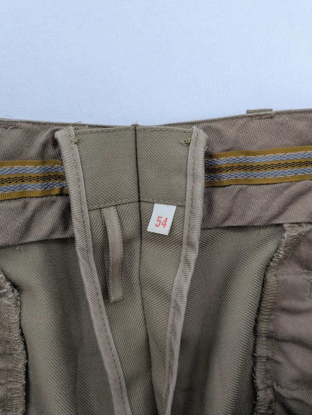 Bundeswehr khaki military uniform trousers with front pleats, zipper, and belt loops.