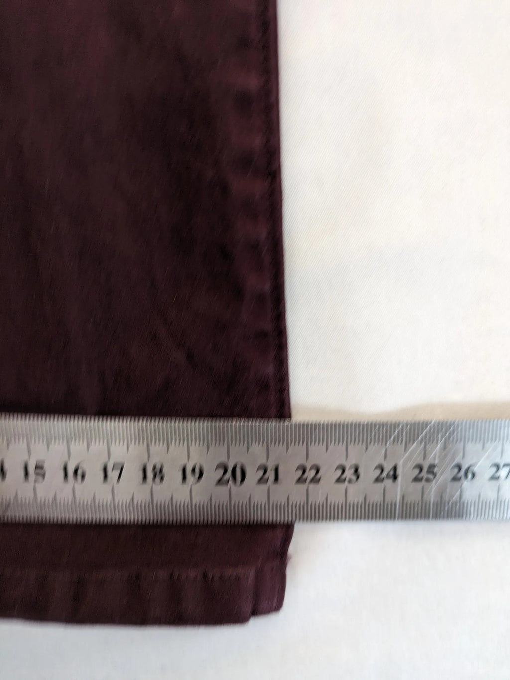 Kazane burgundy overalls with adjustable straps, side button placket, and chest pocket.