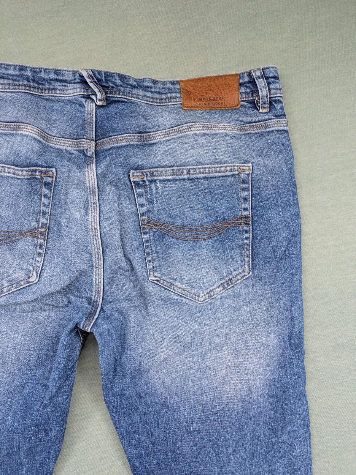 Pull&Bear blue straight jeans with distressed details and classic 5-pocket design.