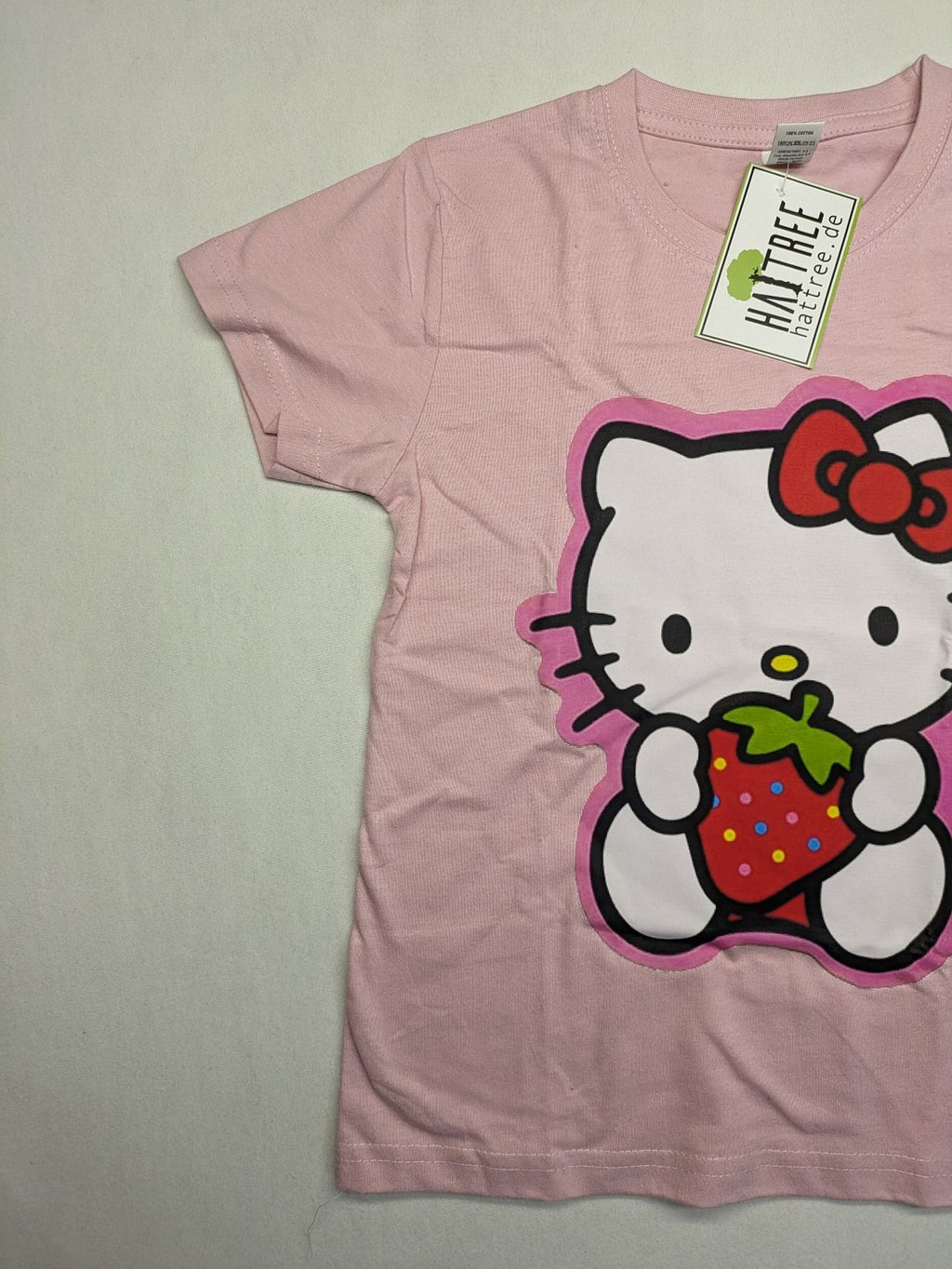 Hello Kitty multi T-shirt pink with large strawberry graphic and short sleeves.