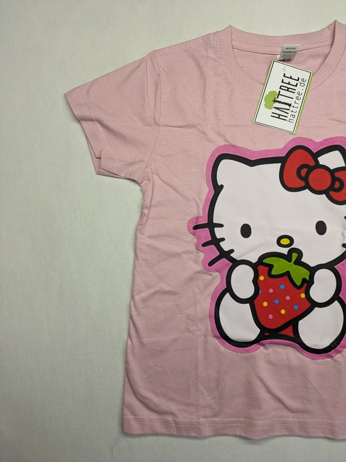 Hello Kitty multi T-shirt pink with large strawberry graphic and short sleeves.