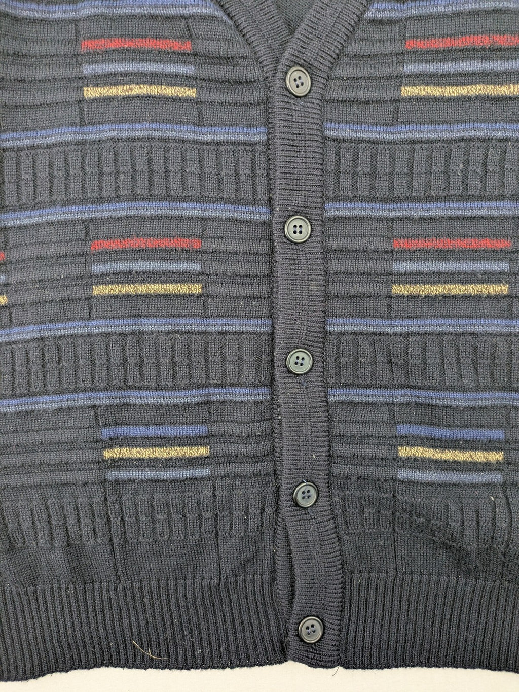 Via Cortesa gold turtle neck jumper with structured pattern and V-neck design.